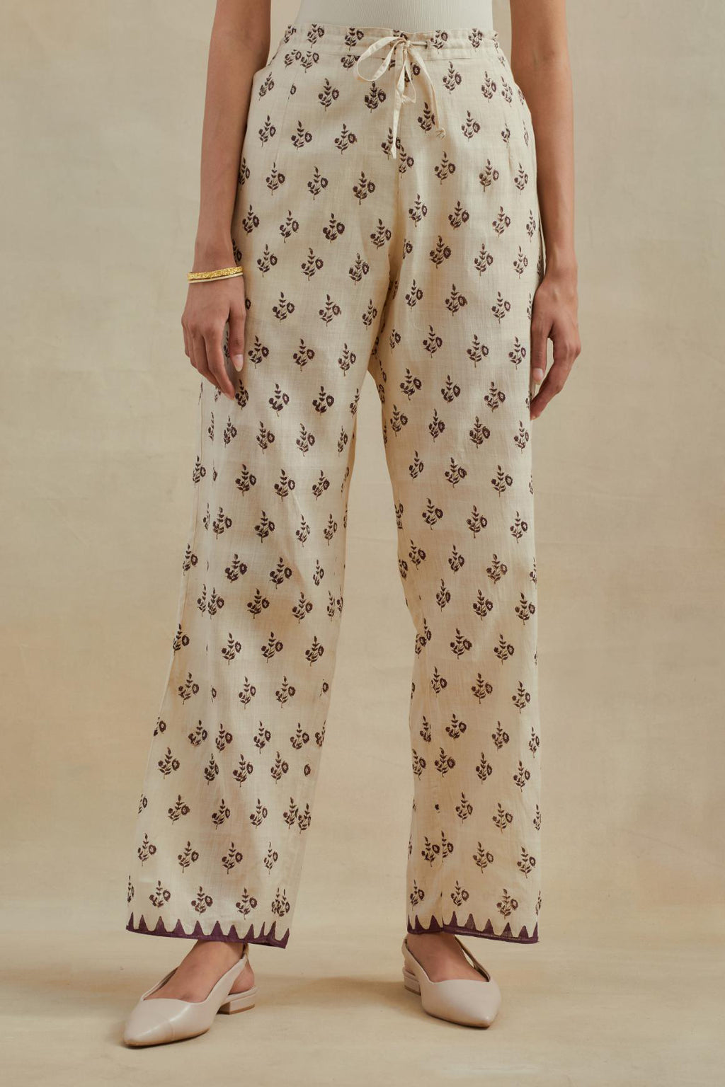 Beige Cotton straight pants with all-over small booti hand block print.