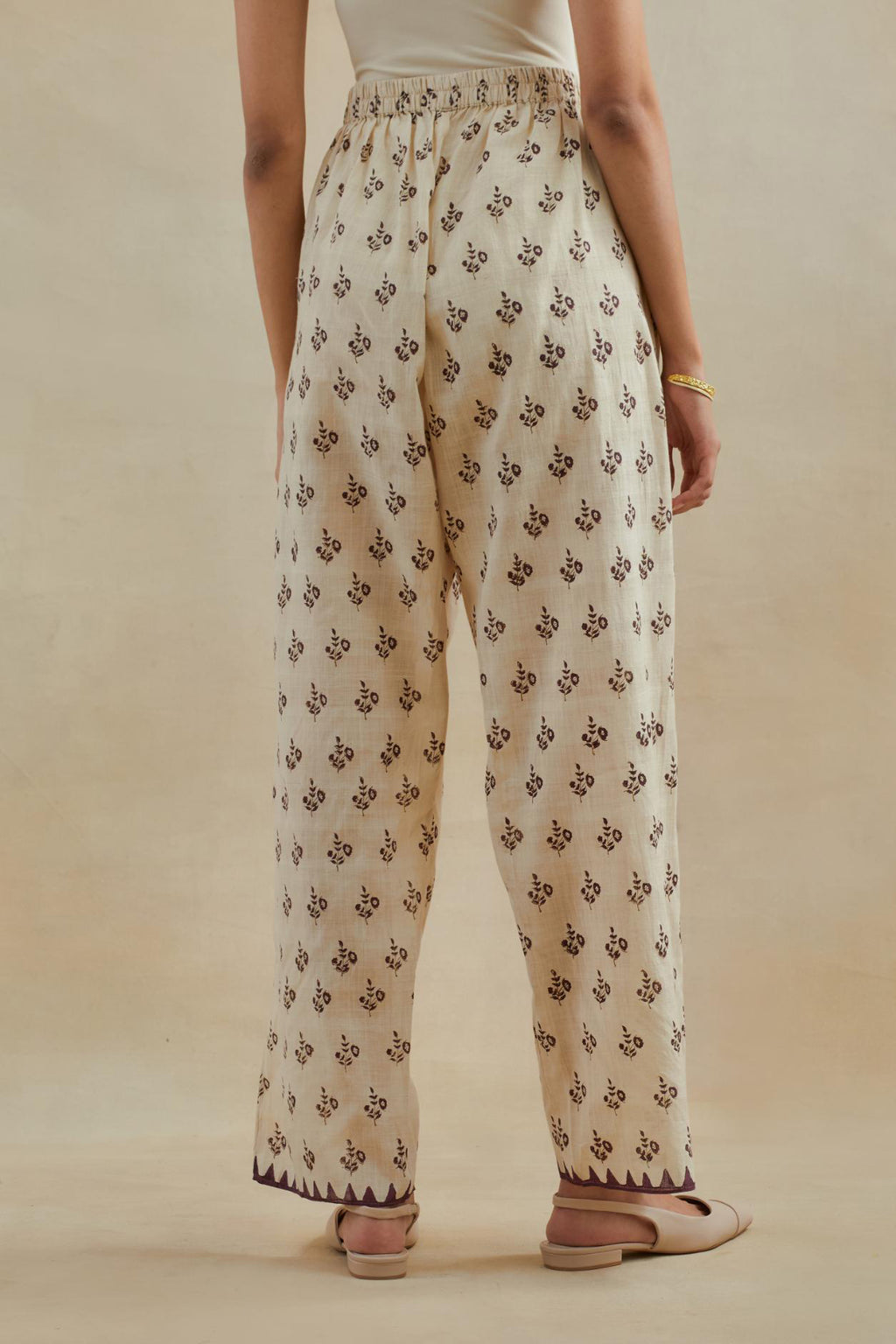 Beige Cotton straight pants with all-over small booti hand block print.