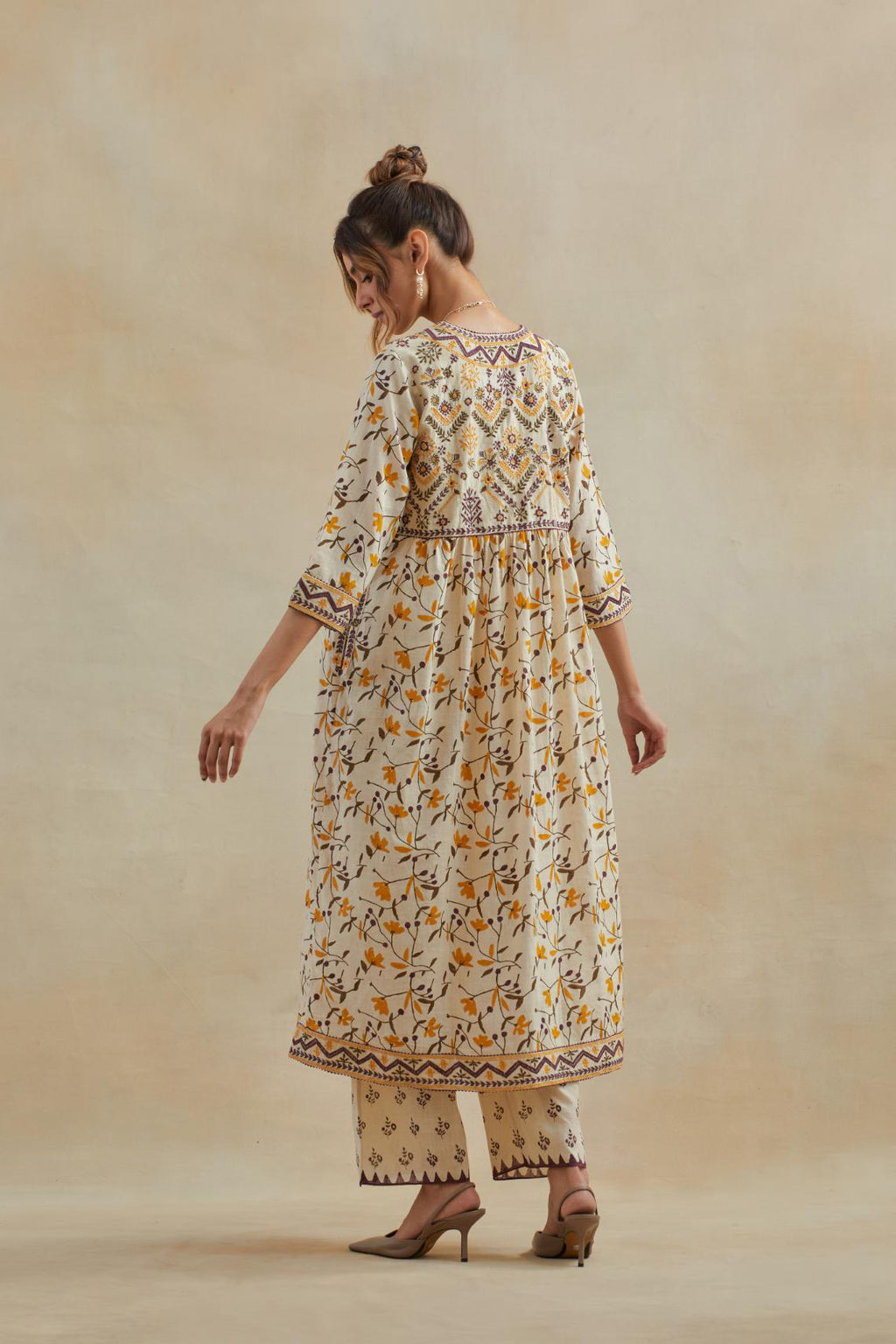 Beige cotton kurta dress set with all-over yellow & purple floral hand block print.