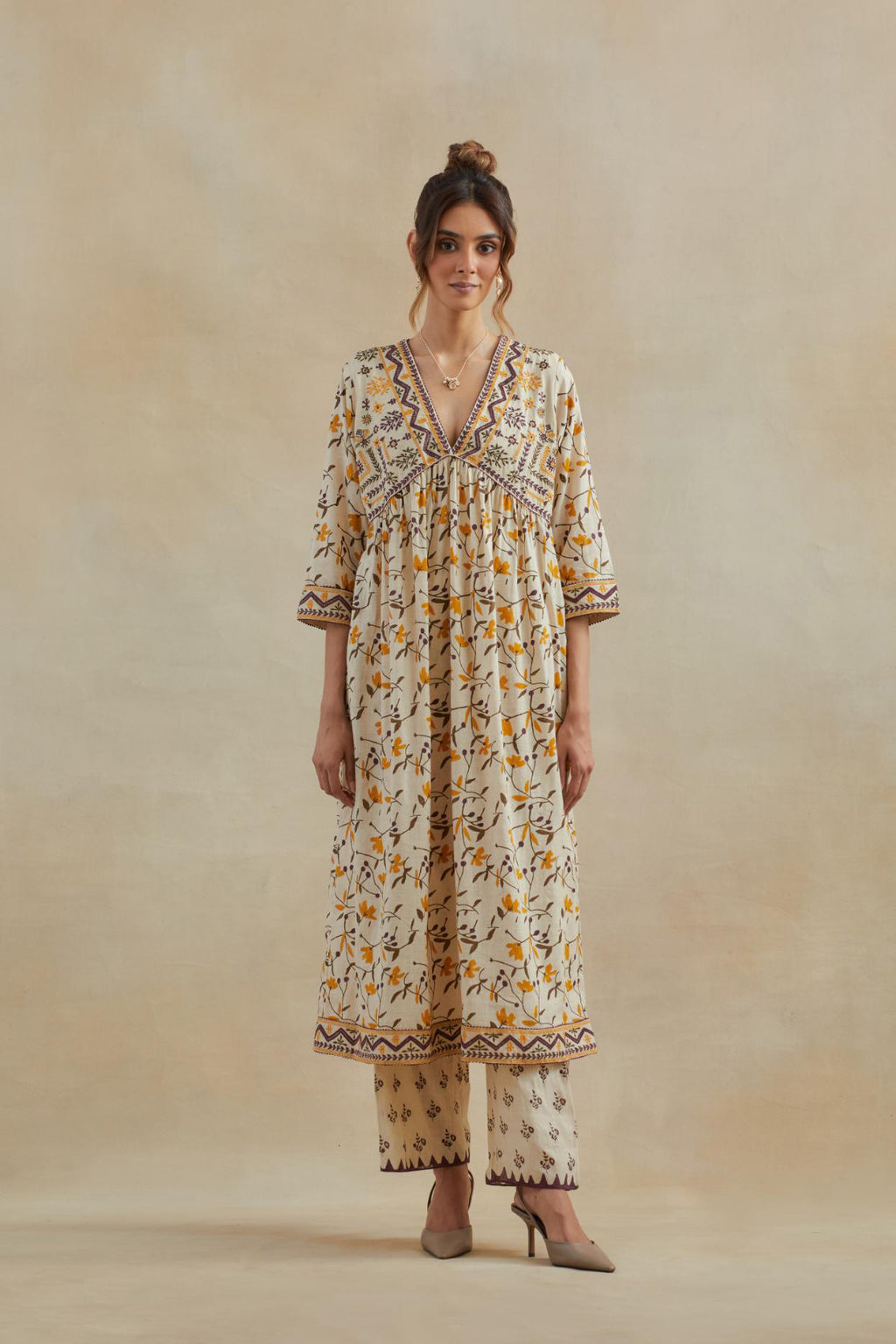 Beige cotton kurta dress set with all-over yellow & purple floral hand block print.