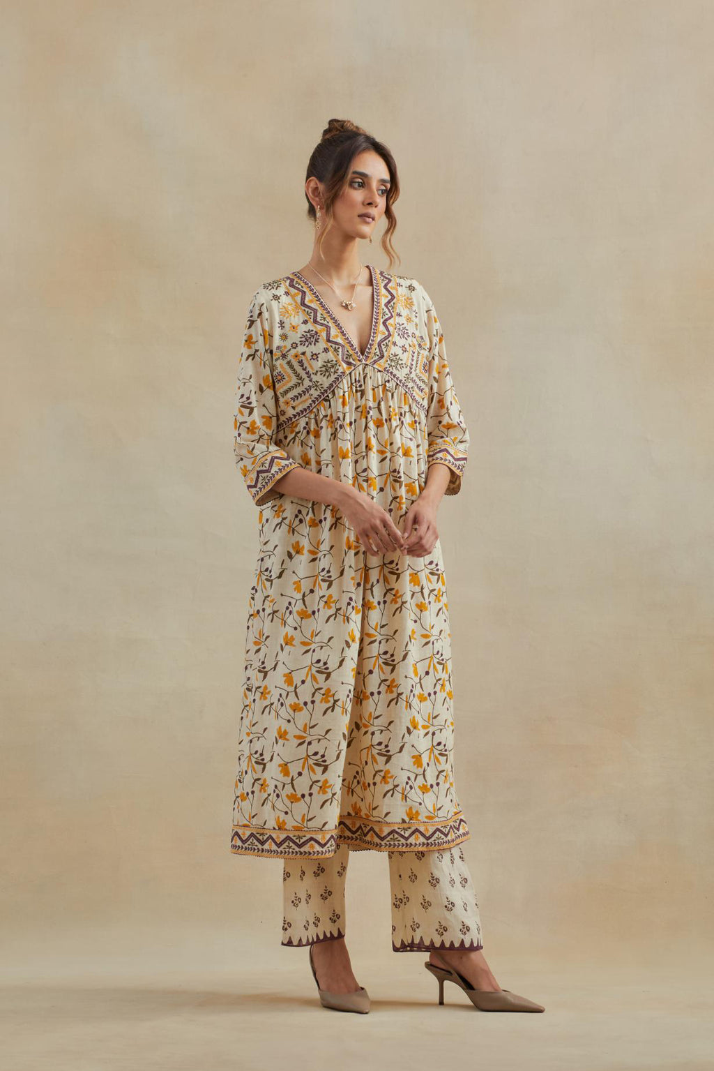 Beige cotton kurta dress set with all-over yellow & purple floral hand block print.