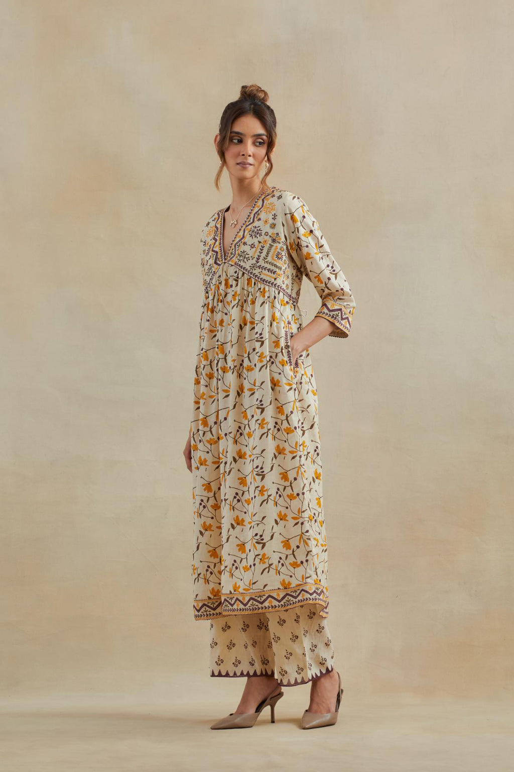 Beige cotton kurta dress set with all-over yellow & purple floral hand block print.