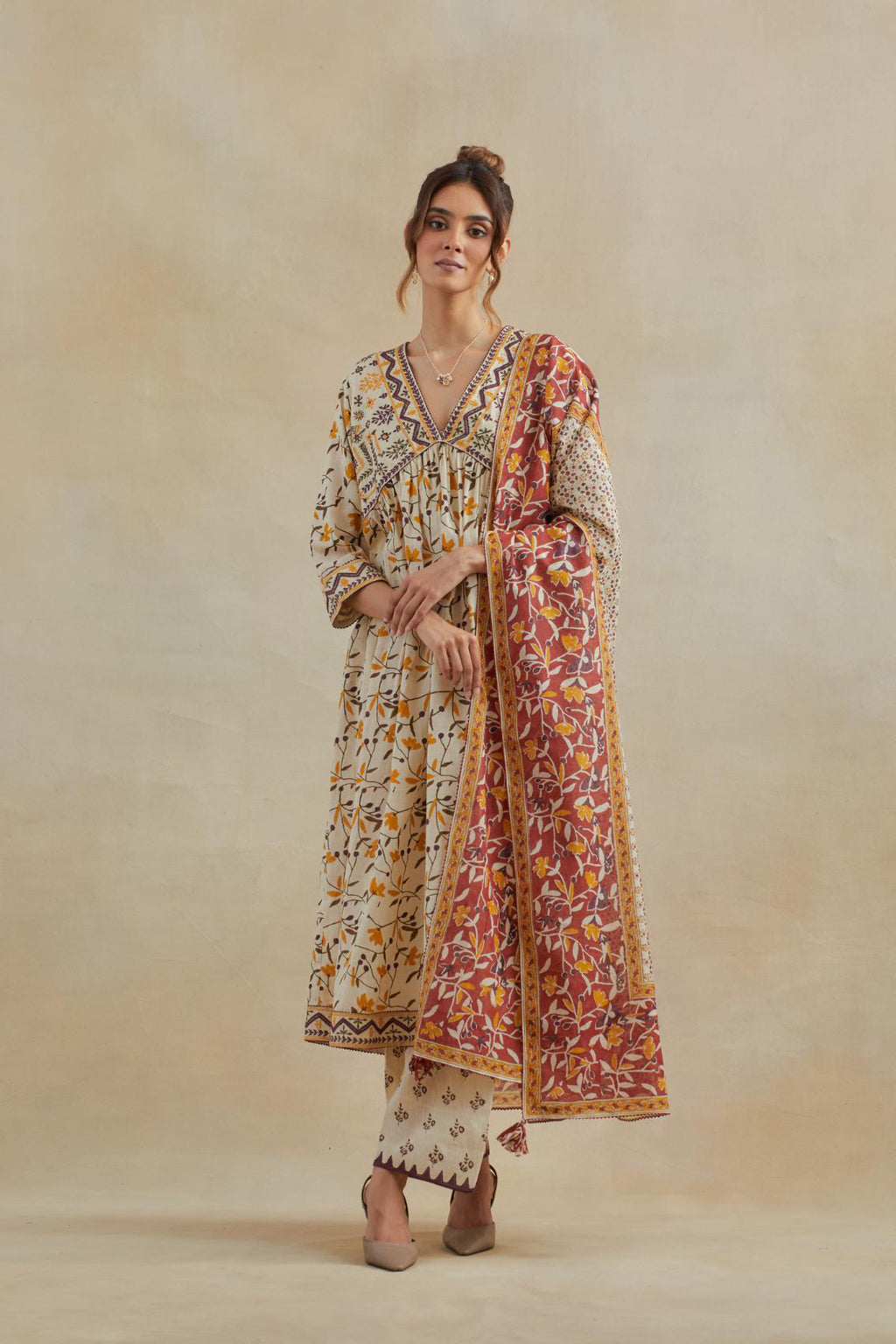 Beige cotton kurta dress set with all-over yellow & purple floral hand block print.