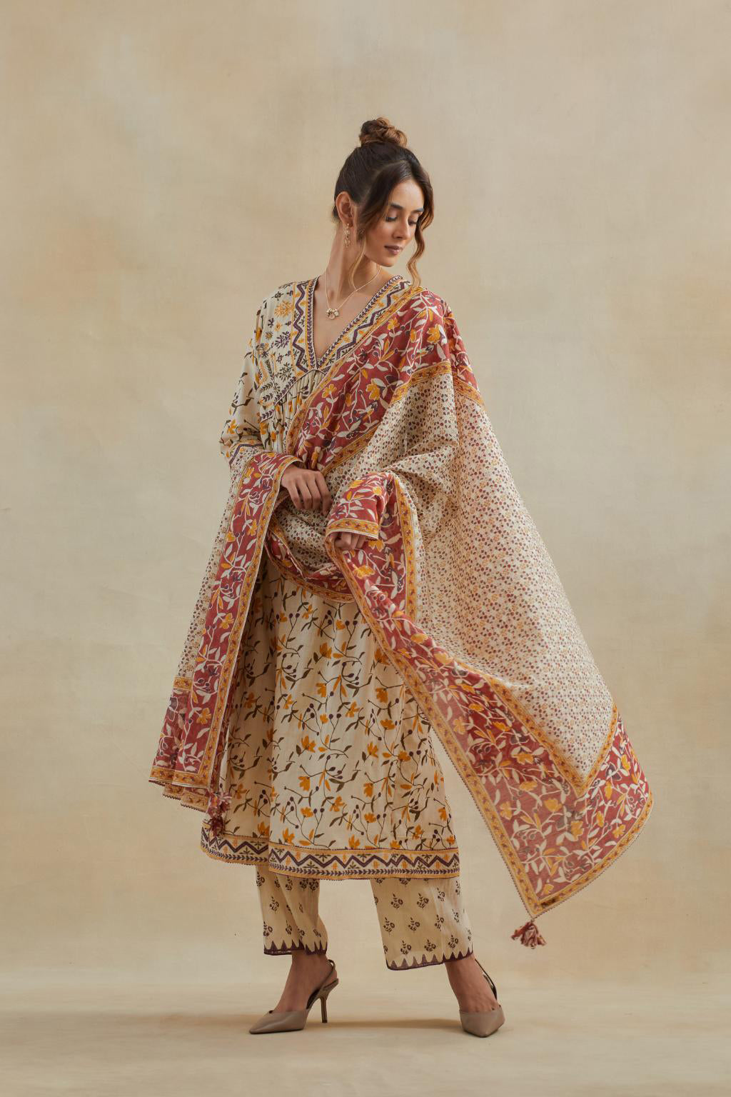 Beige cotton kurta dress set with all-over yellow & purple floral hand block print.
