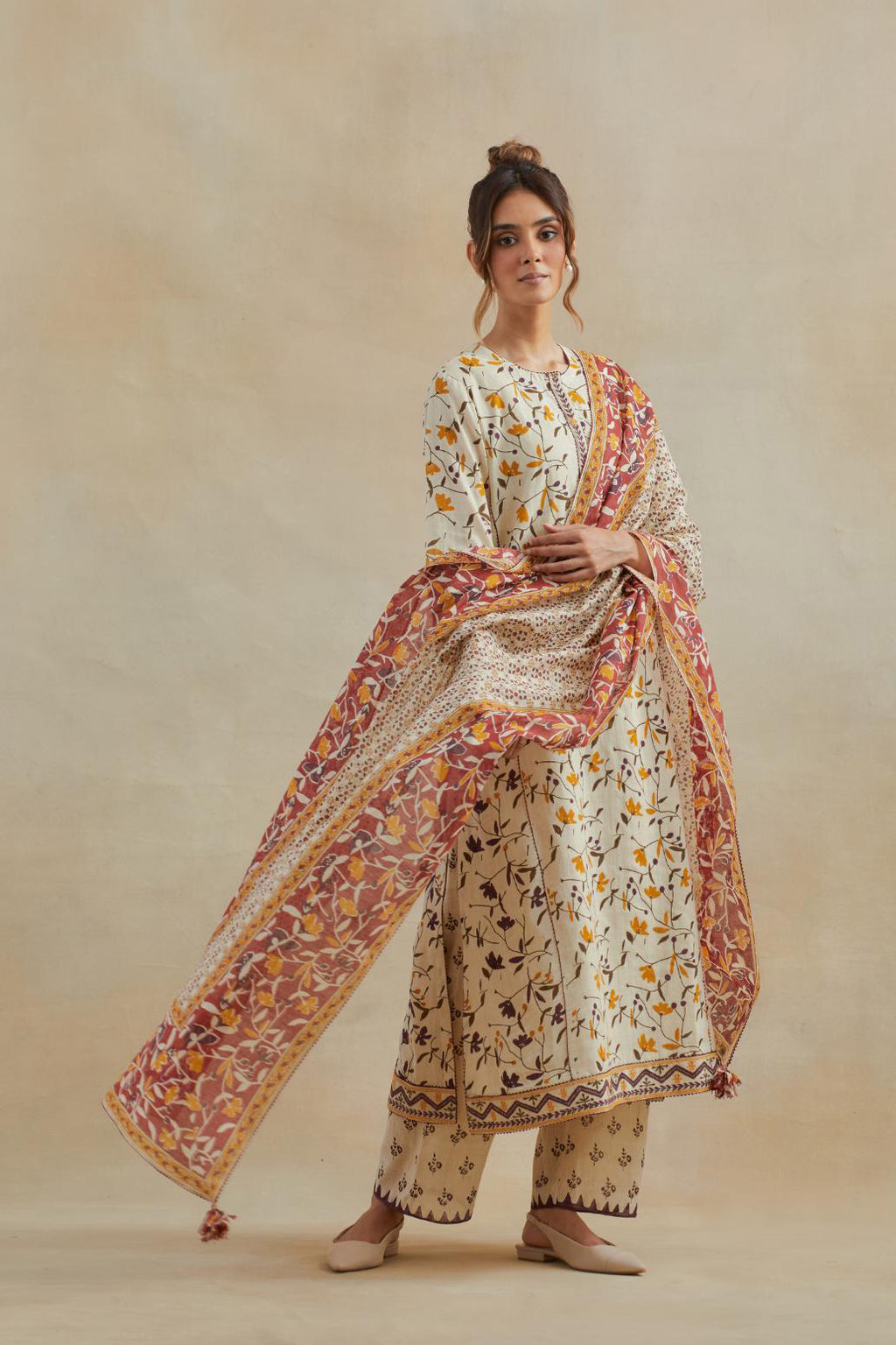 Beige cotton chanderi dupatta with all-over multi colored hand block print.