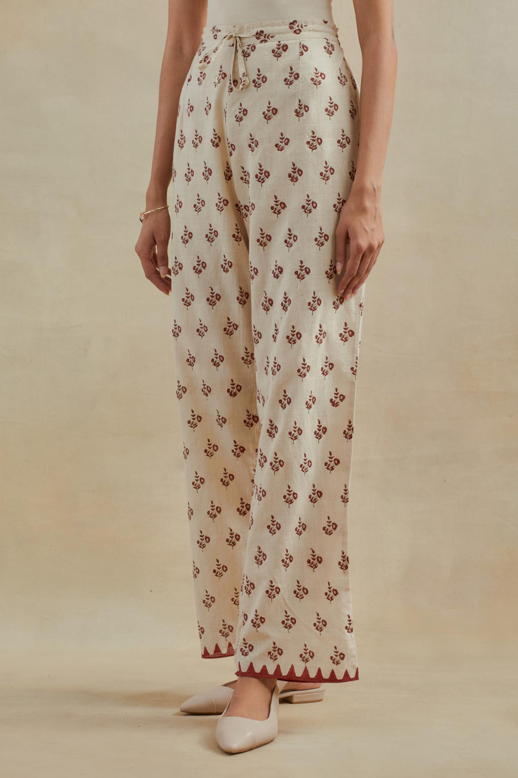 Beige Cotton straight pants with all-over small booti hand block print.