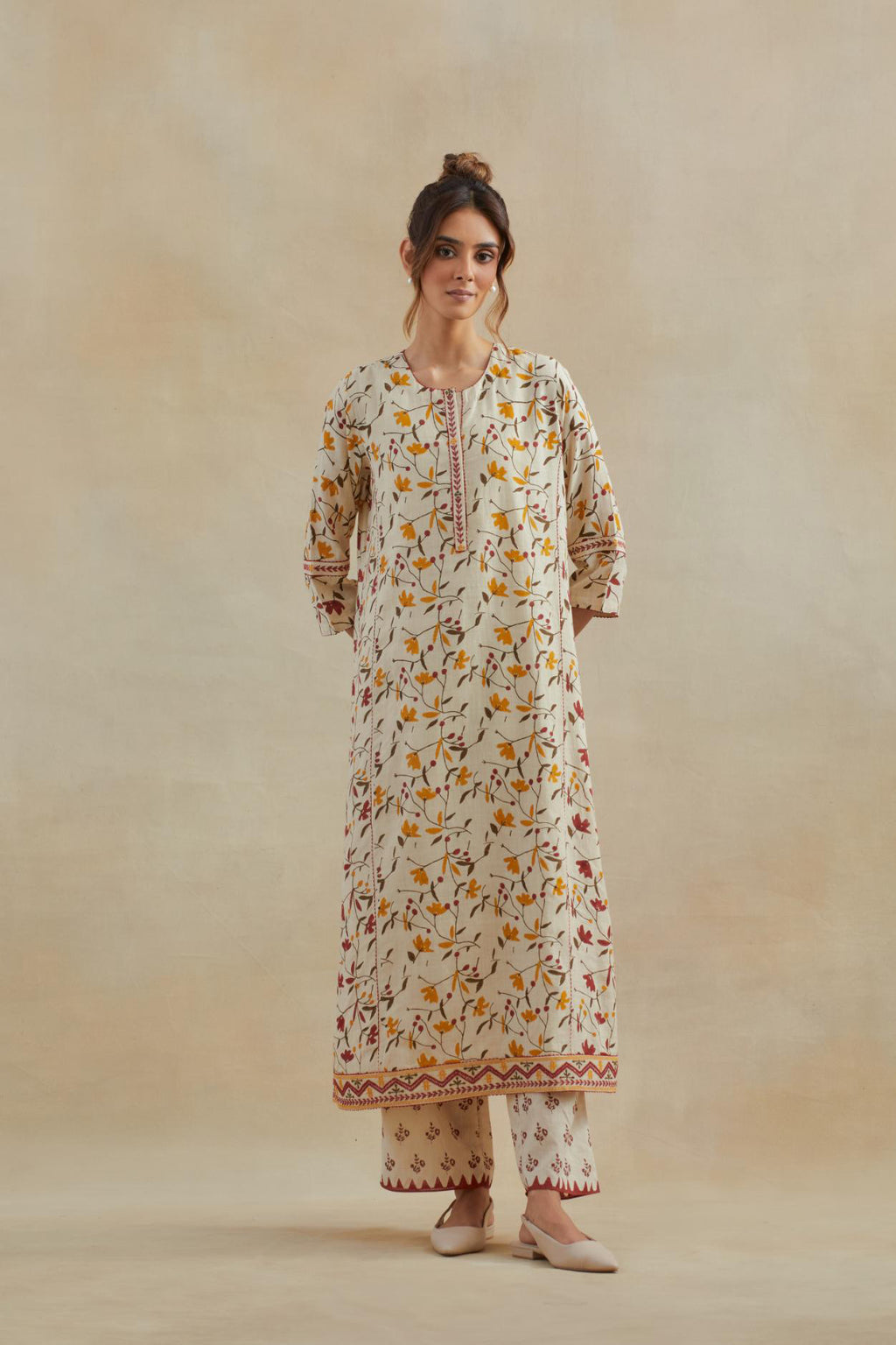 Beige cotton straight kurta set with all-over yellow & red colored flower hand block print & and side panels.