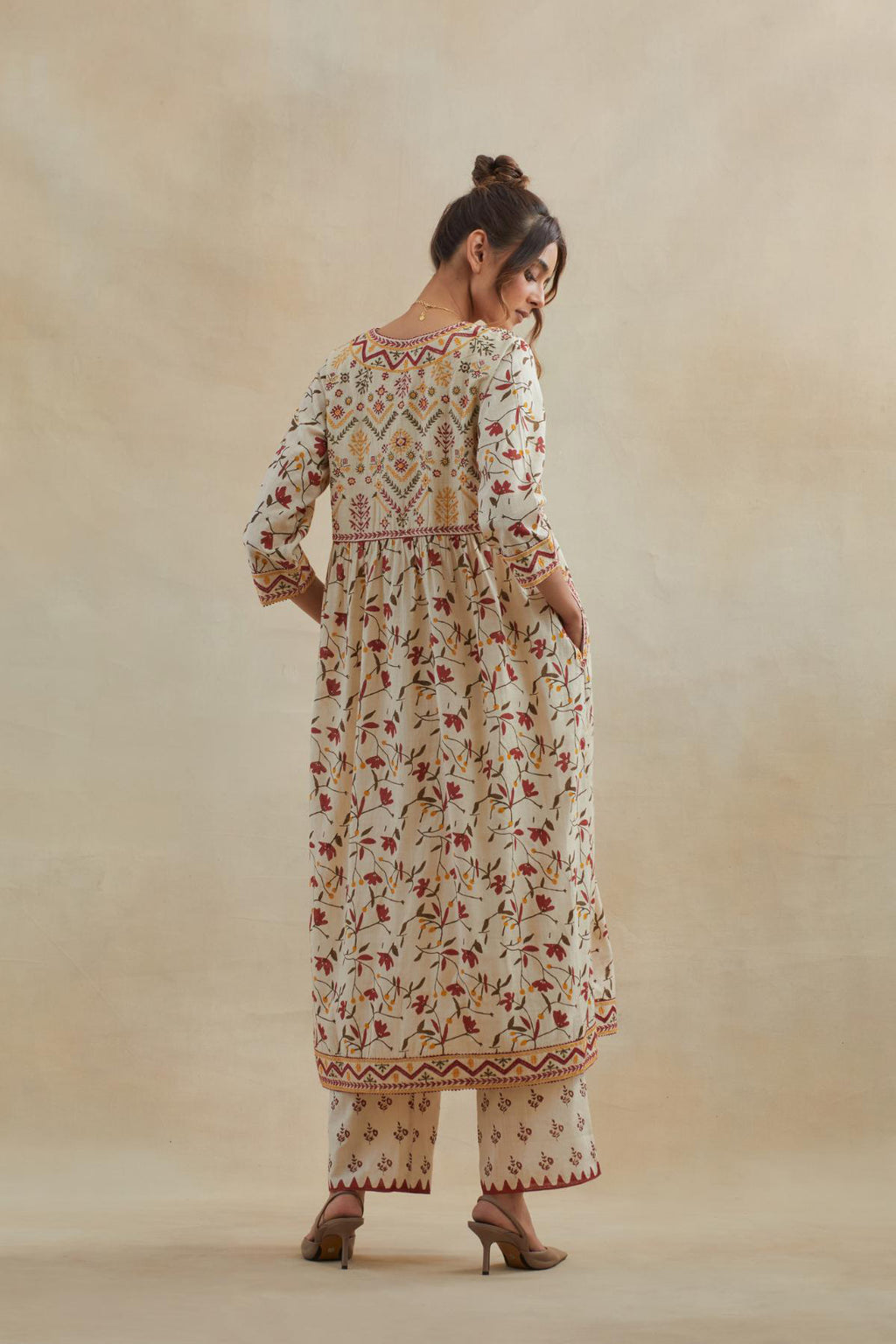 Beige cotton kurta dress set with all-over yellow & red floral hand block print.