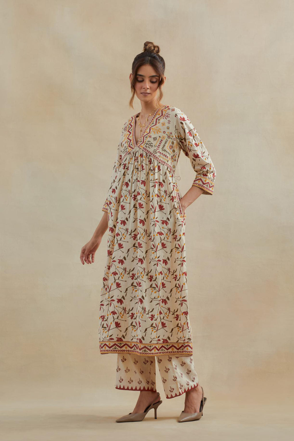 Beige cotton kurta dress set with all-over yellow & red floral hand block print.