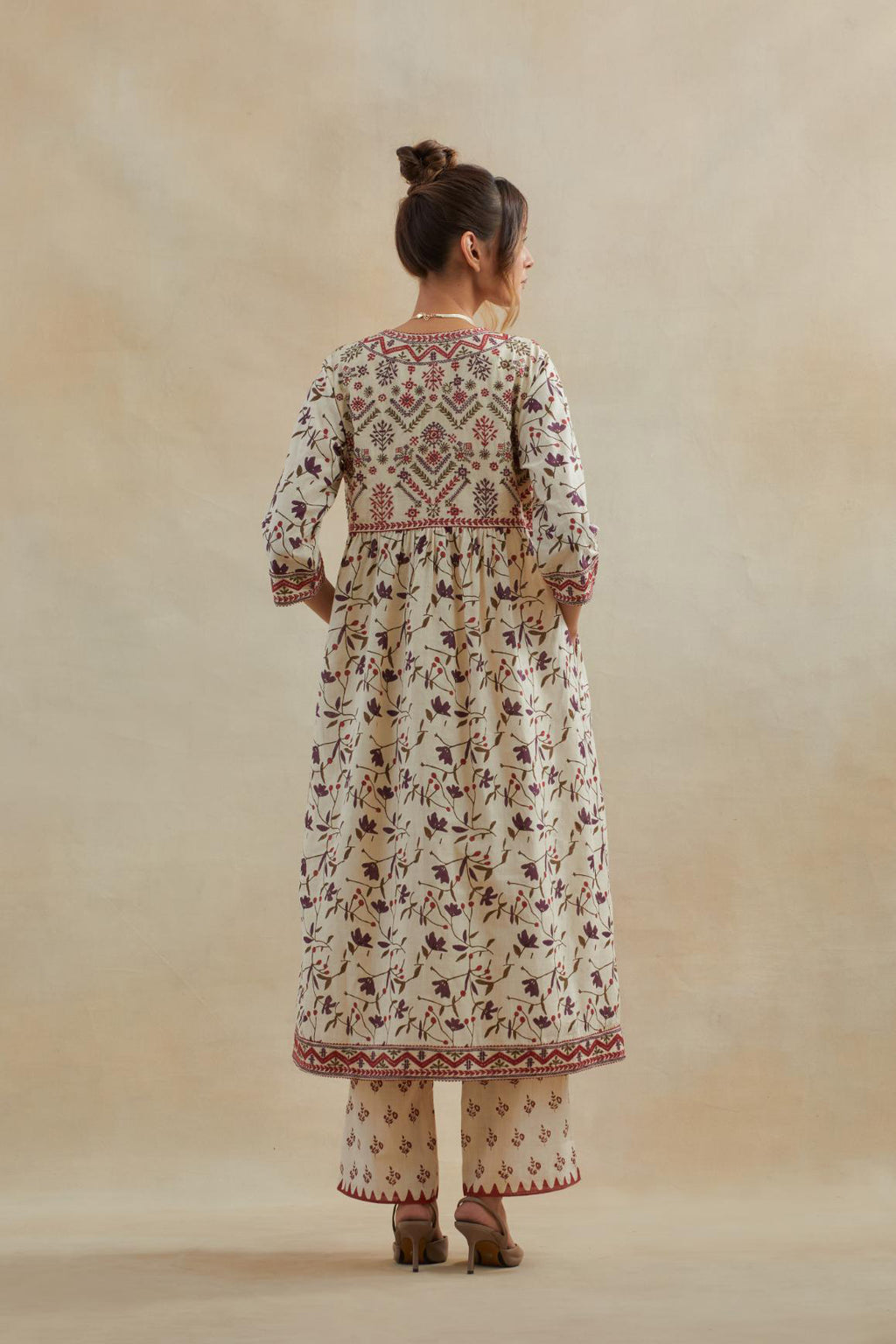 Beige cotton kurta dress set with all-over rust & green floral hand block print.