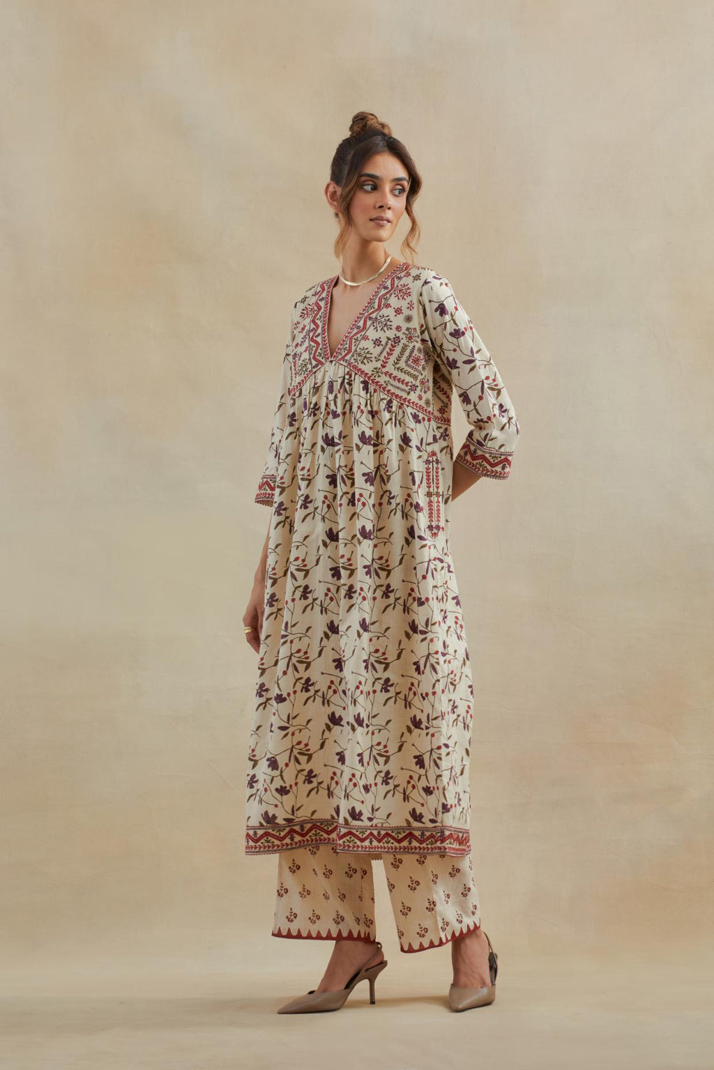 Beige cotton kurta dress set with all-over rust & green floral hand block print.