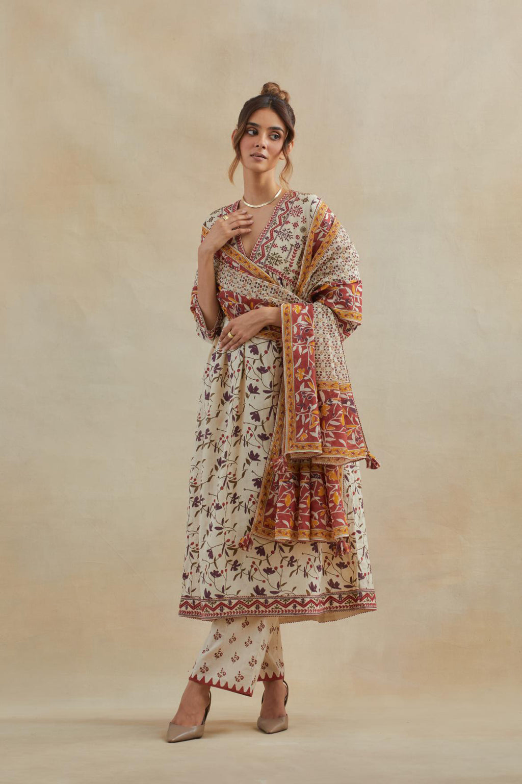 Beige cotton kurta dress set with all-over rust & green floral hand block print.