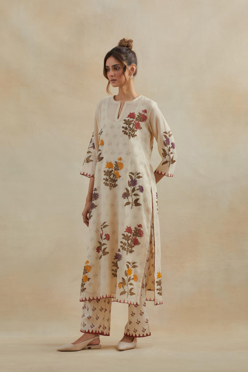 Beige cotton chanderi straight kurta set with all-over multi colored floral hand block print.