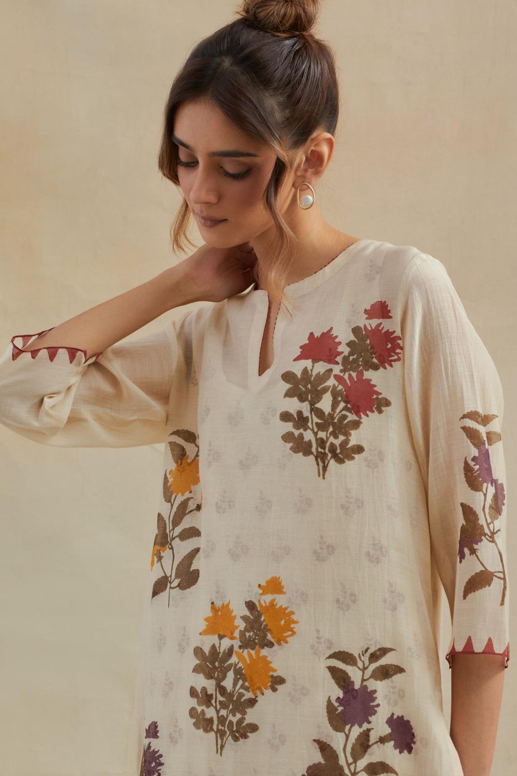 Beige cotton chanderi straight kurta set with all-over multi colored floral hand block print.