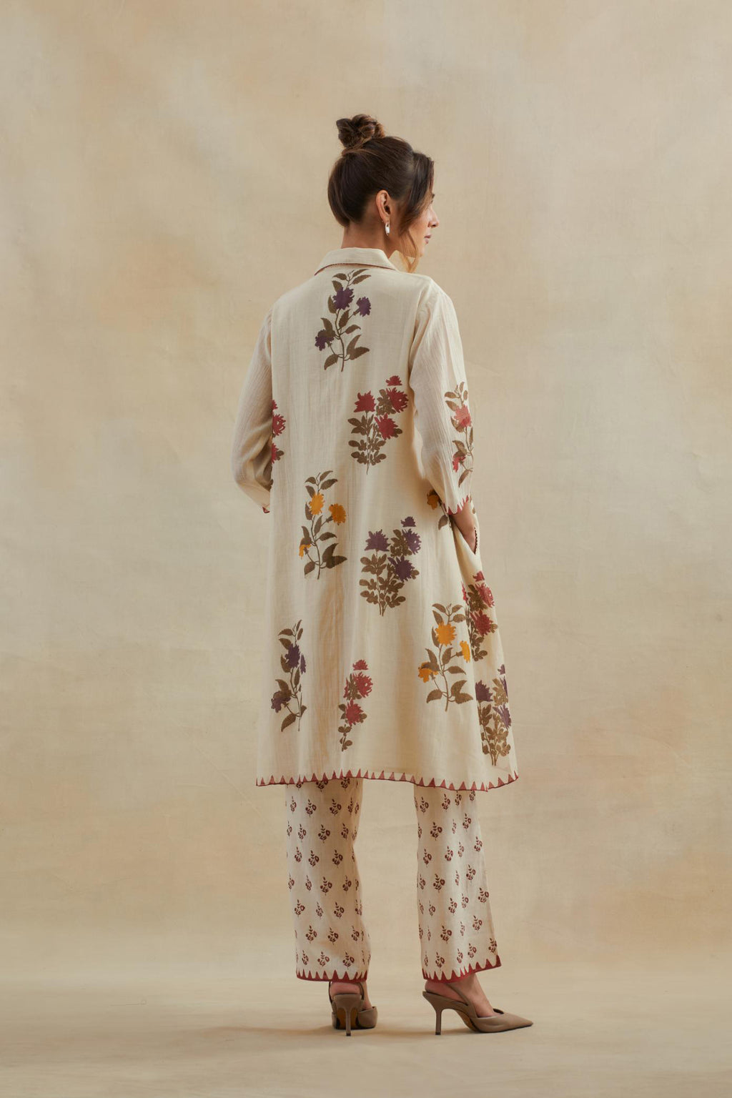Beige cotton chanderi hand block printed A-line short kurta set with all-over multi colored flower.