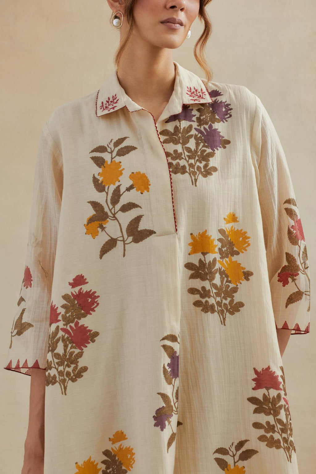 Beige cotton chanderi hand block printed A-line short kurta set with all-over multi colored flower.