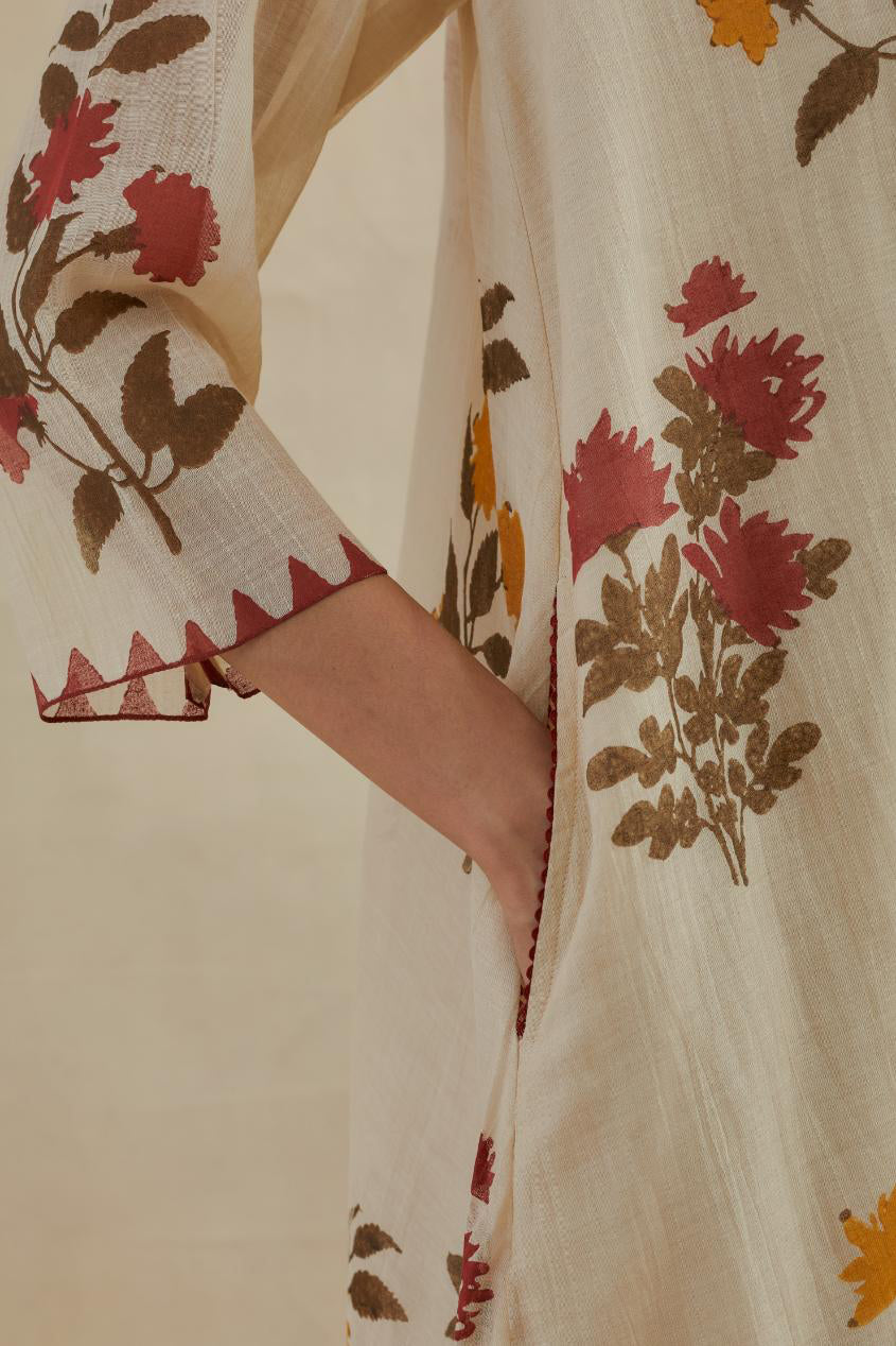 Beige cotton chanderi hand block printed A-line short kurta set with all-over multi colored flower.