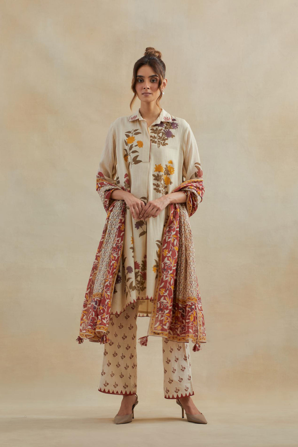 Beige cotton chanderi hand block printed A-line short kurta set with all-over multi colored flower.
