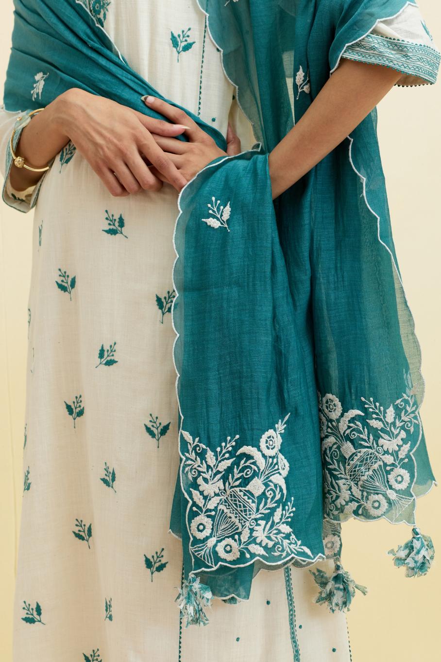 Off white cotton kalidar straight kurta set, highlighted with tropical teal thread embroidery.