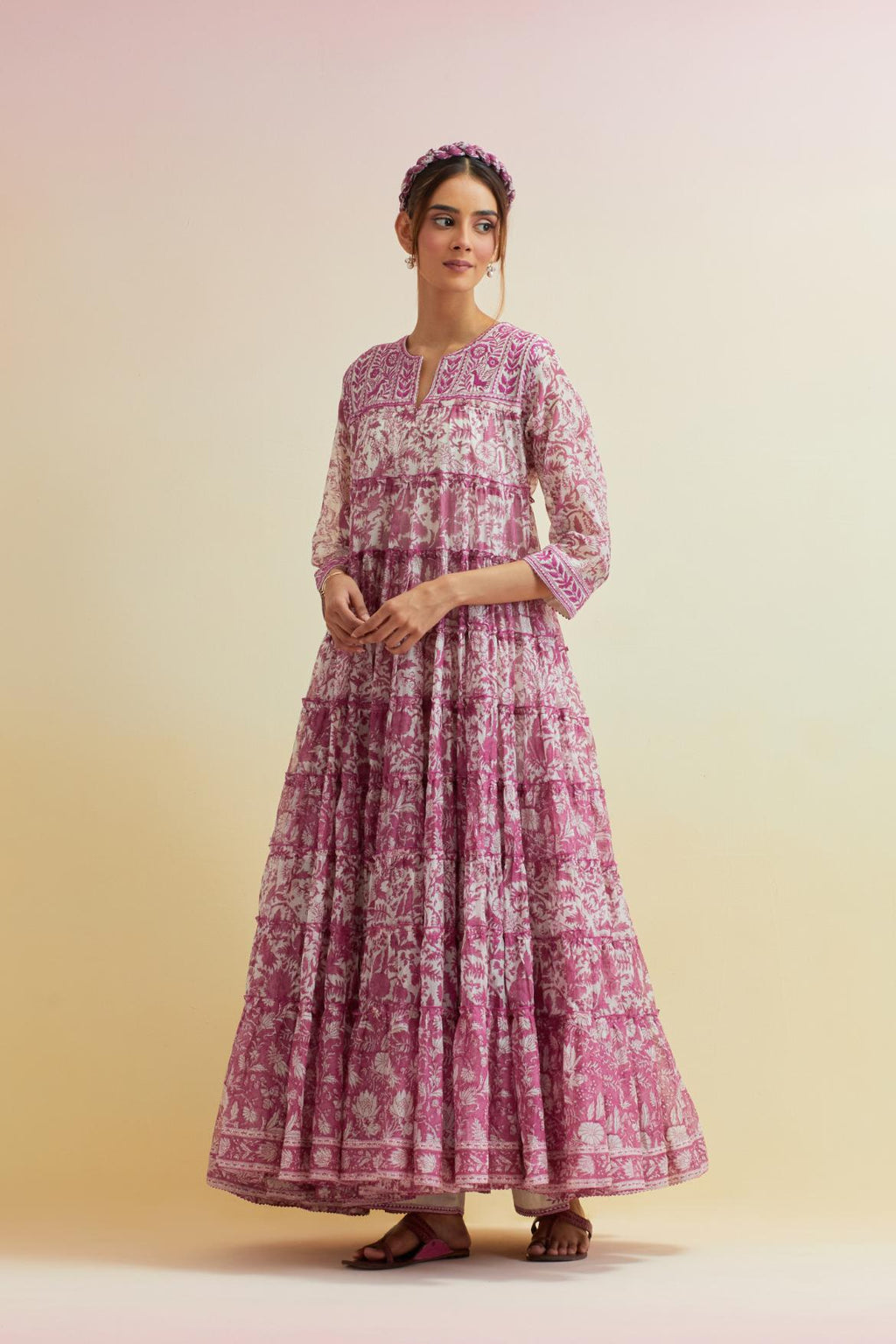 Orchid pink hand block printed multi-tiered kurta dress set with 3/4 sleeves, highlighted with thread embroidered yoke in front and back.