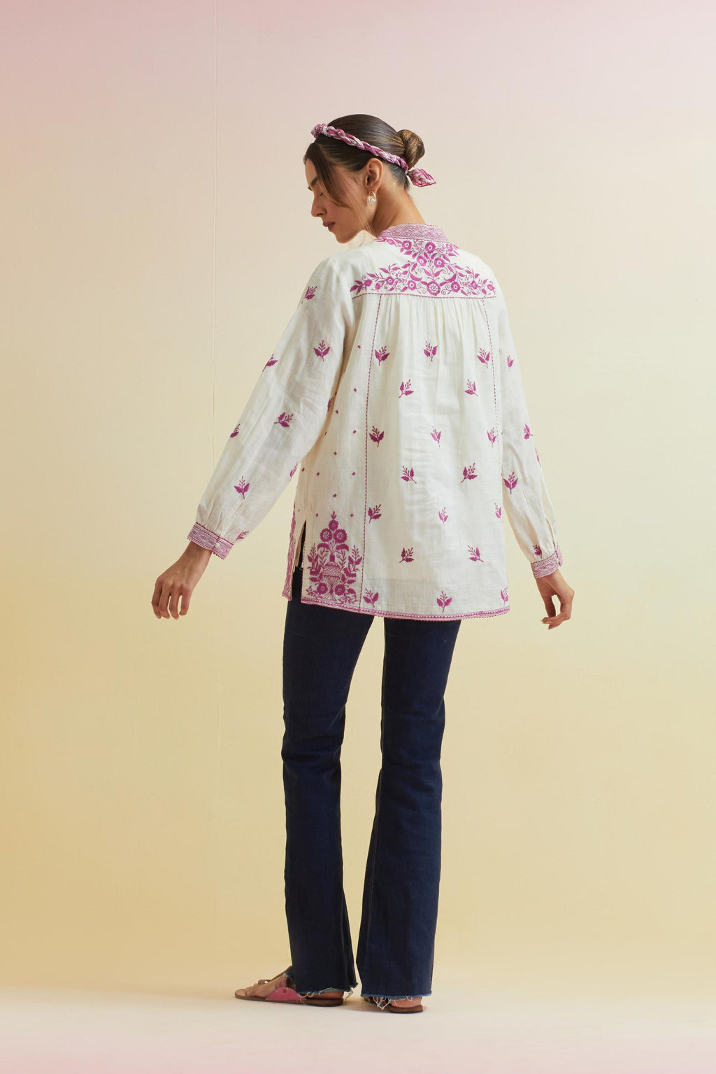 Off white cotton straight short top with all-over orchid pink thread embroidery.