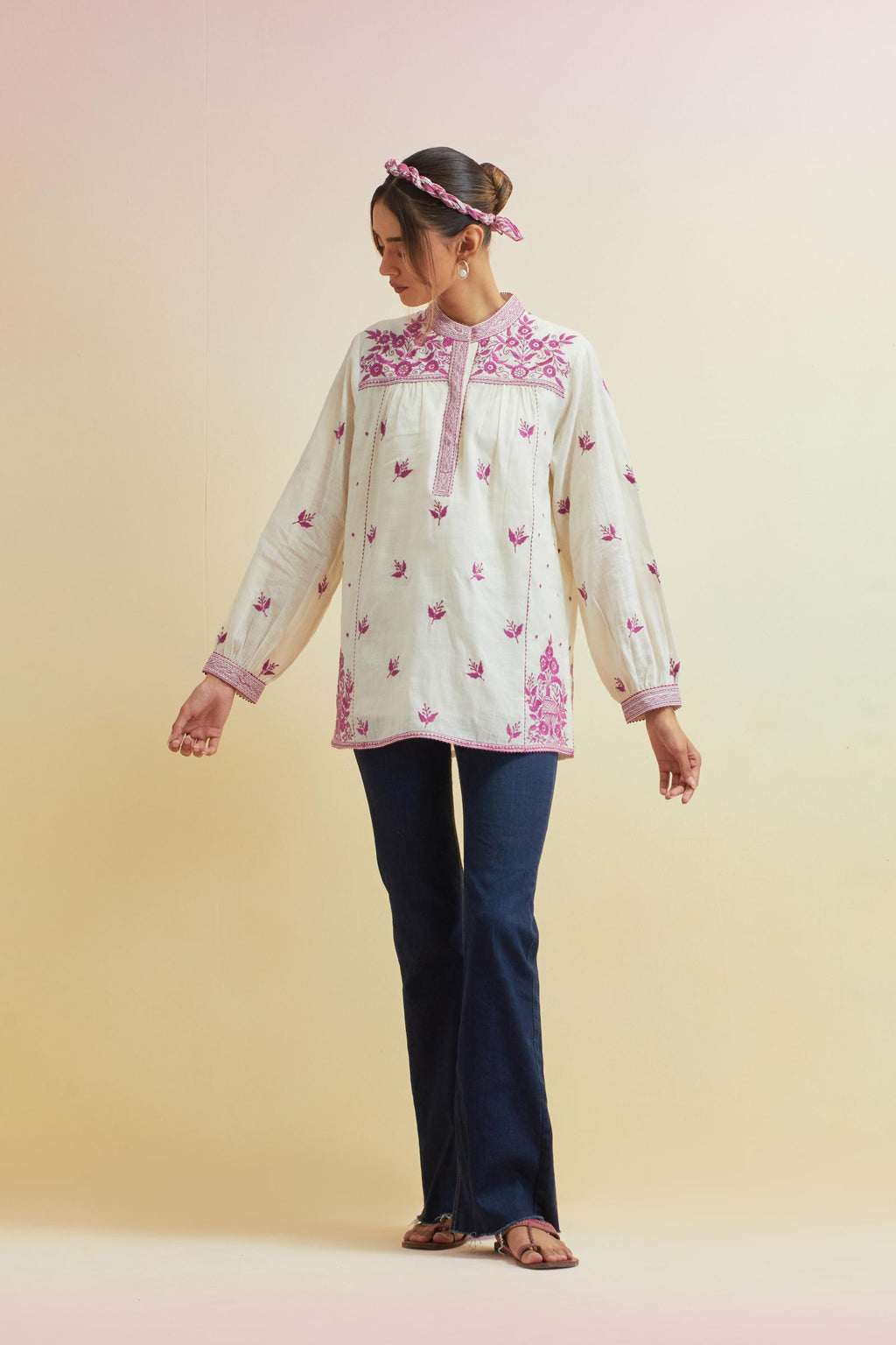 Off white cotton straight short top with all-over orchid pink thread embroidery.