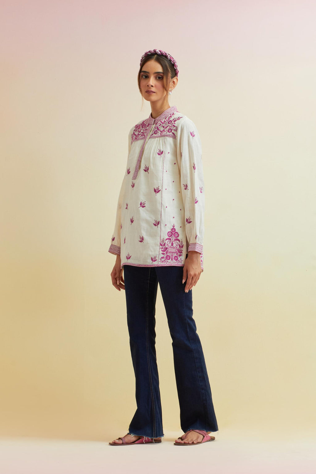 Off white cotton straight short top with all-over orchid pink thread embroidery.