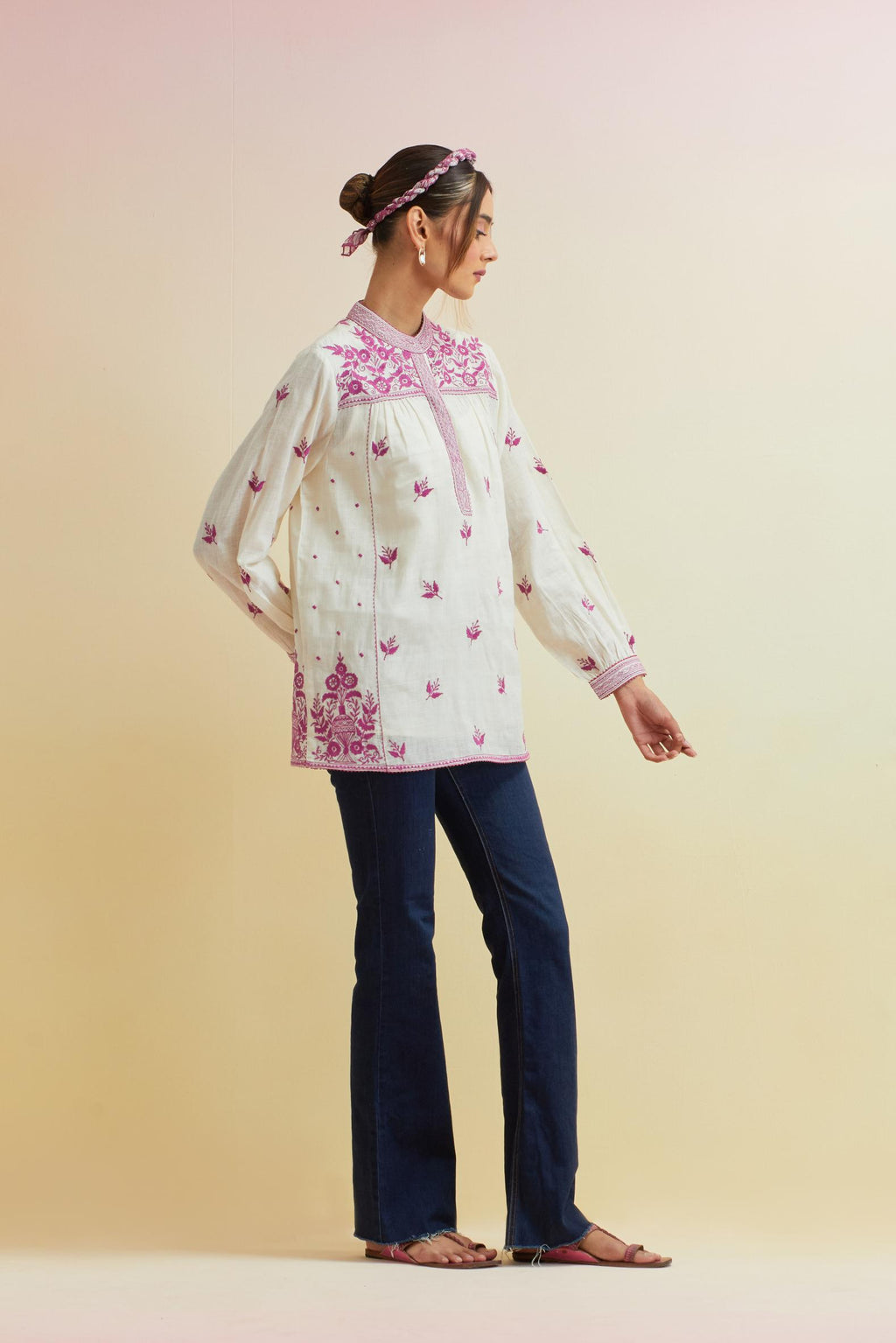 Off white cotton straight short top with all-over orchid pink thread embroidery.