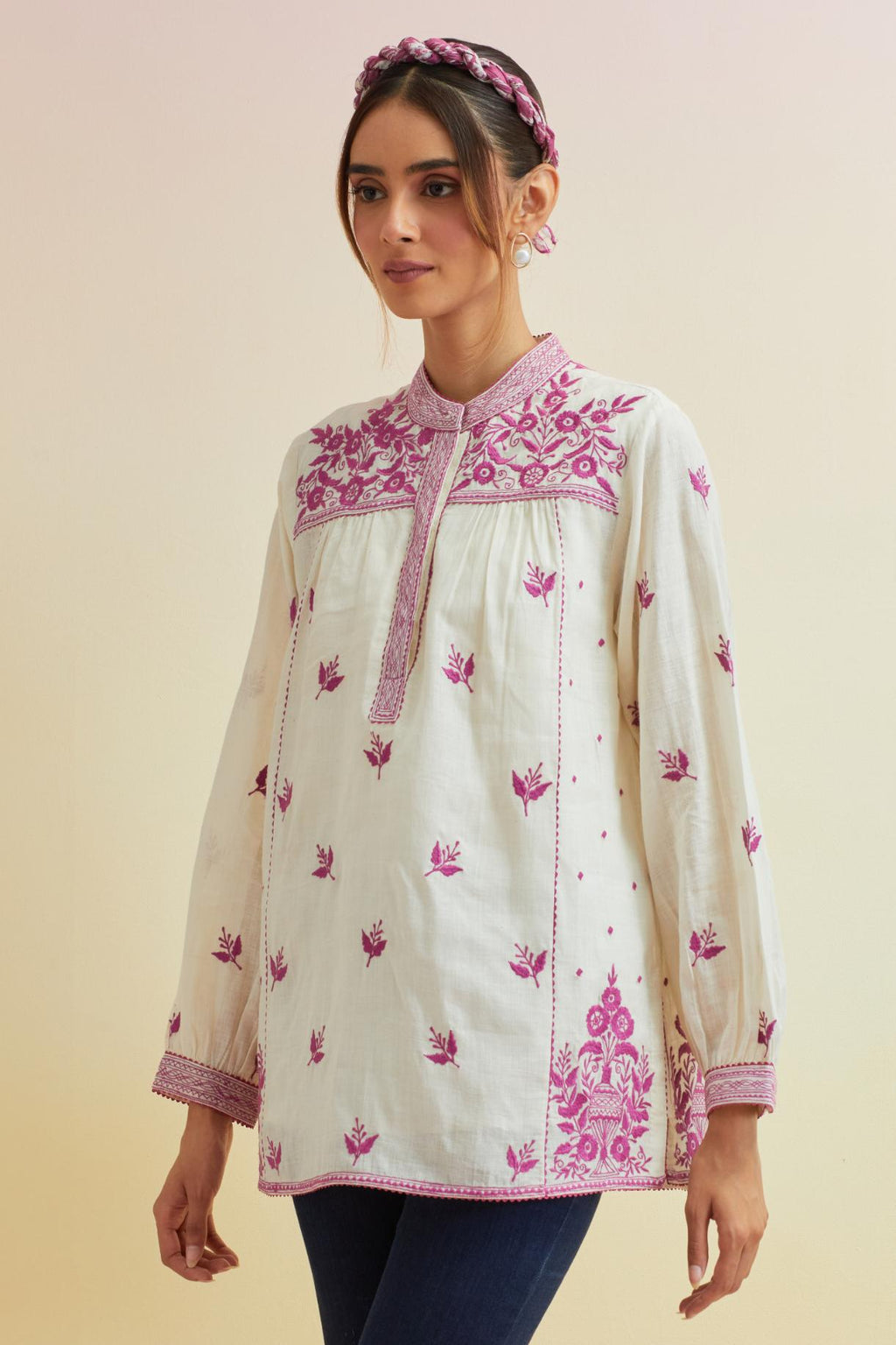 Off white cotton straight short top with all-over orchid pink thread embroidery.