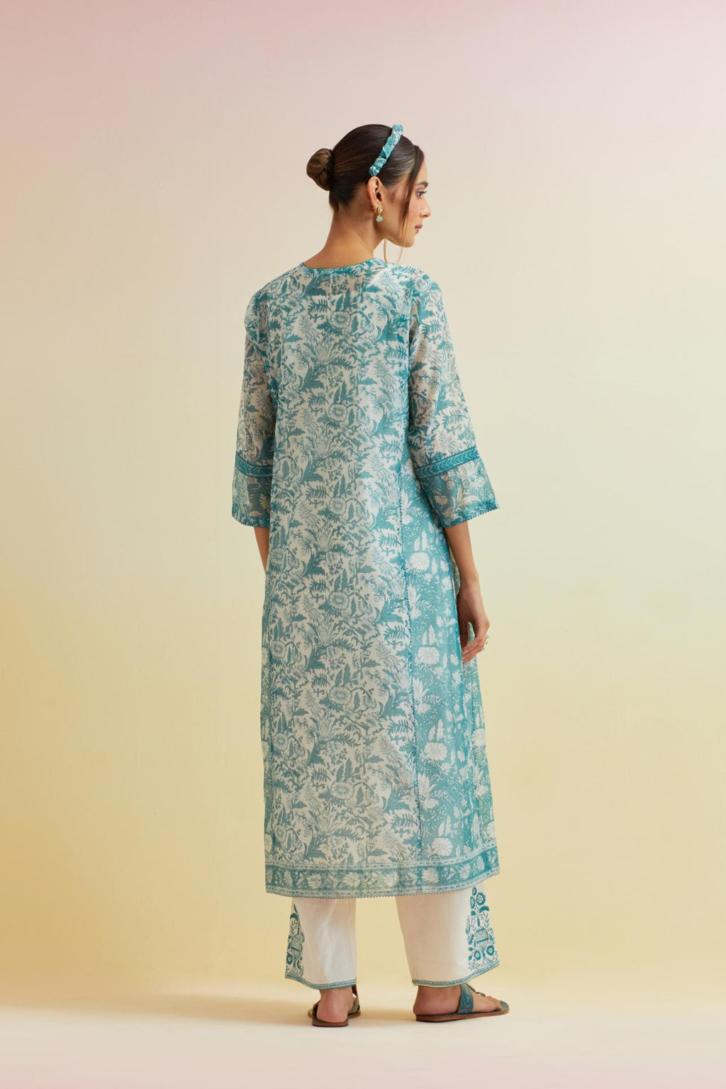 Tropical teal hand block printed kalidar straight kurta set, highlighted with thread embroidery.