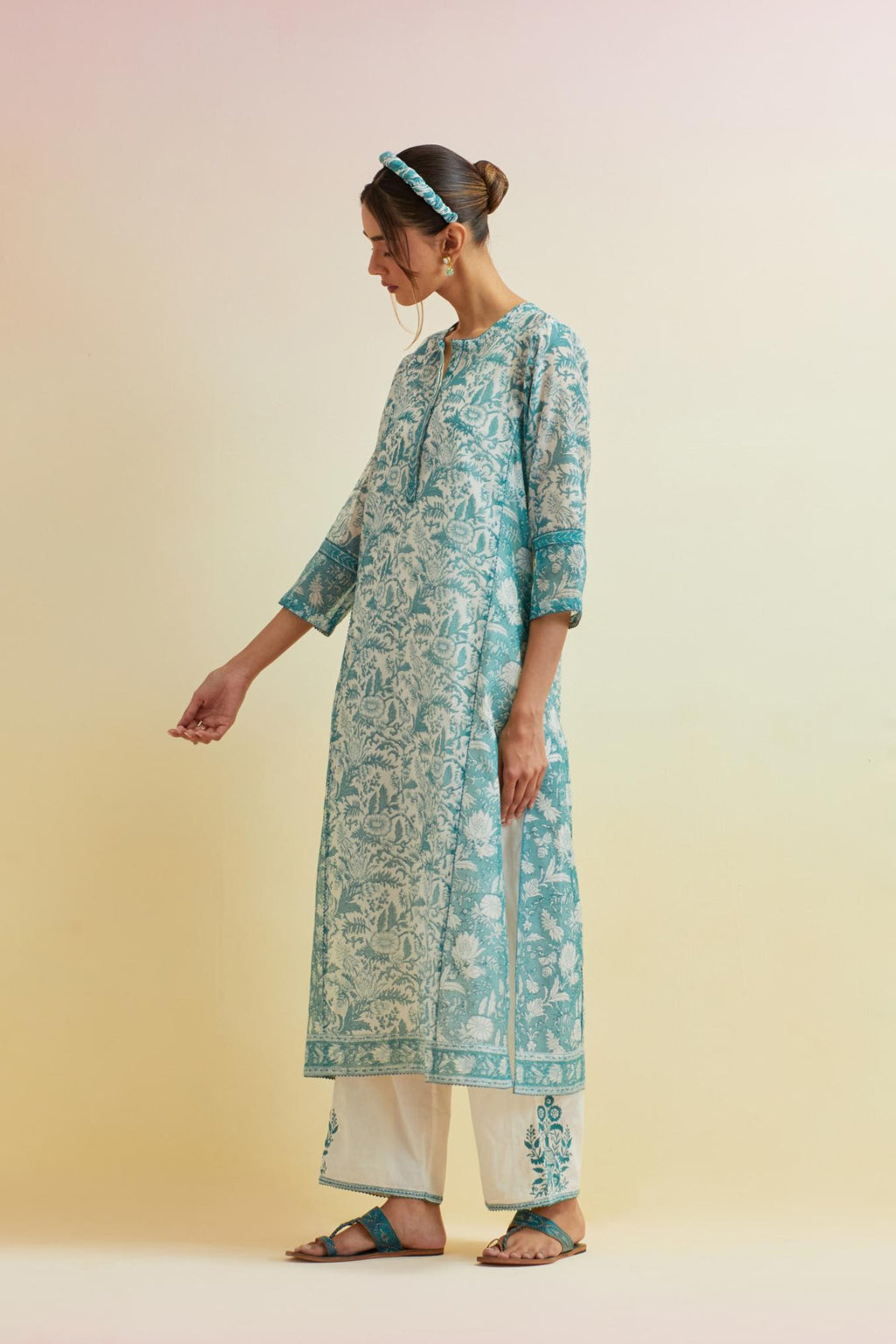 Tropical teal hand block printed kalidar straight kurta set, highlighted with thread embroidery.