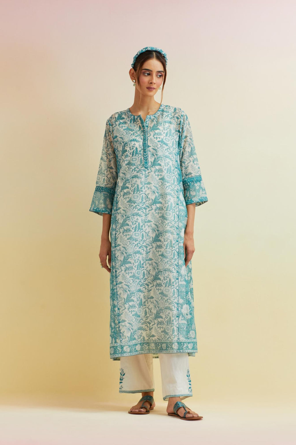 Tropical teal hand block printed kalidar straight kurta set, highlighted with thread embroidery.