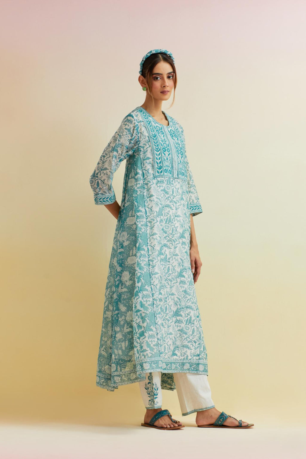 Tropical teal A-line hand block printed long kurta set with thread embroidered yoke and side kalis.