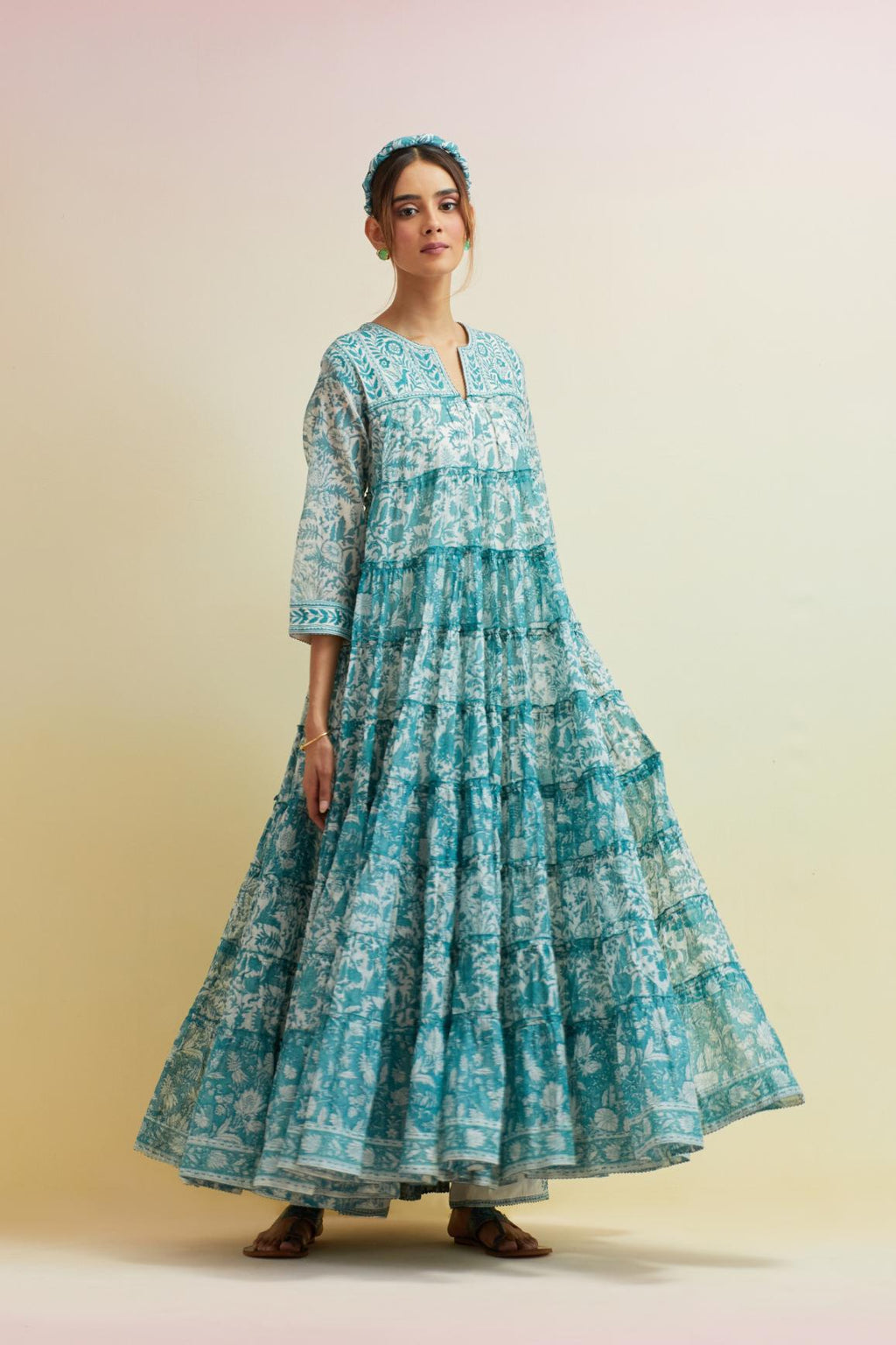 Tropical teal hand block printed multi-tiered kurta dress set with 3/4 sleeves, highlighted with thread embroidered yoke in front and back.