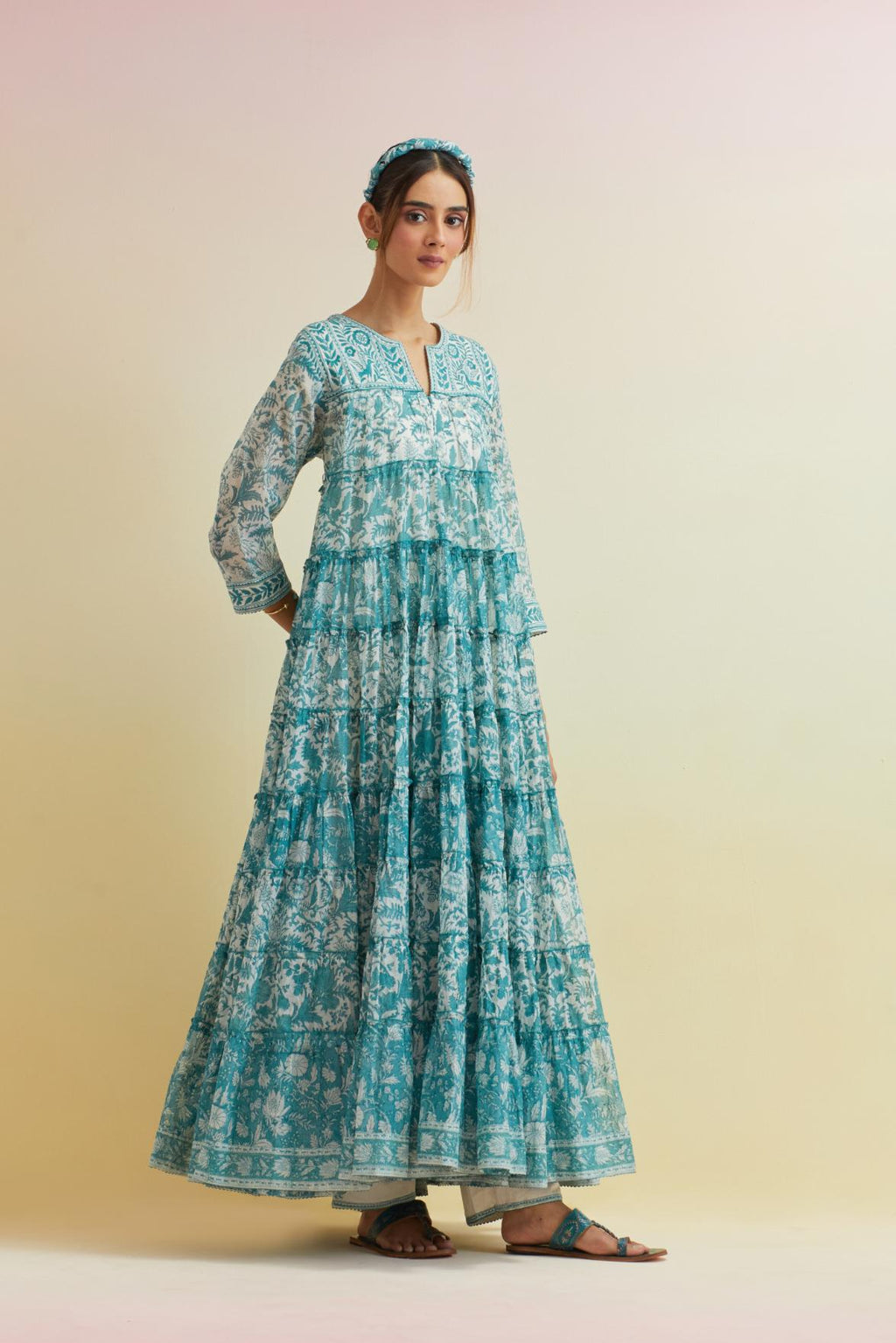 Tropical teal hand block printed multi-tiered kurta dress set with 3/4 sleeves, highlighted with thread embroidered yoke in front and back.