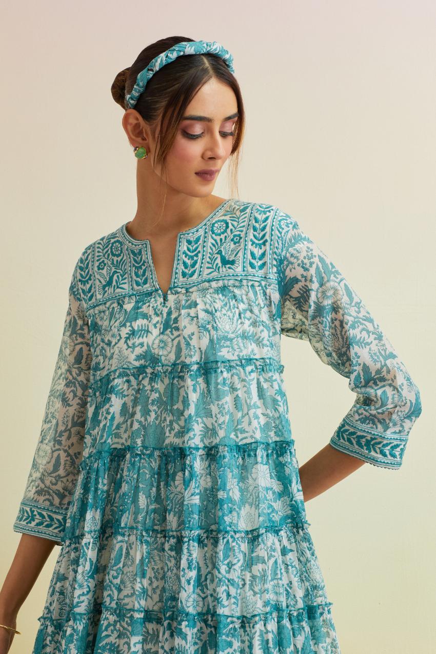 Tropical teal hand block printed multi-tiered kurta dress set with 3/4 sleeves, highlighted with thread embroidered yoke in front and back.