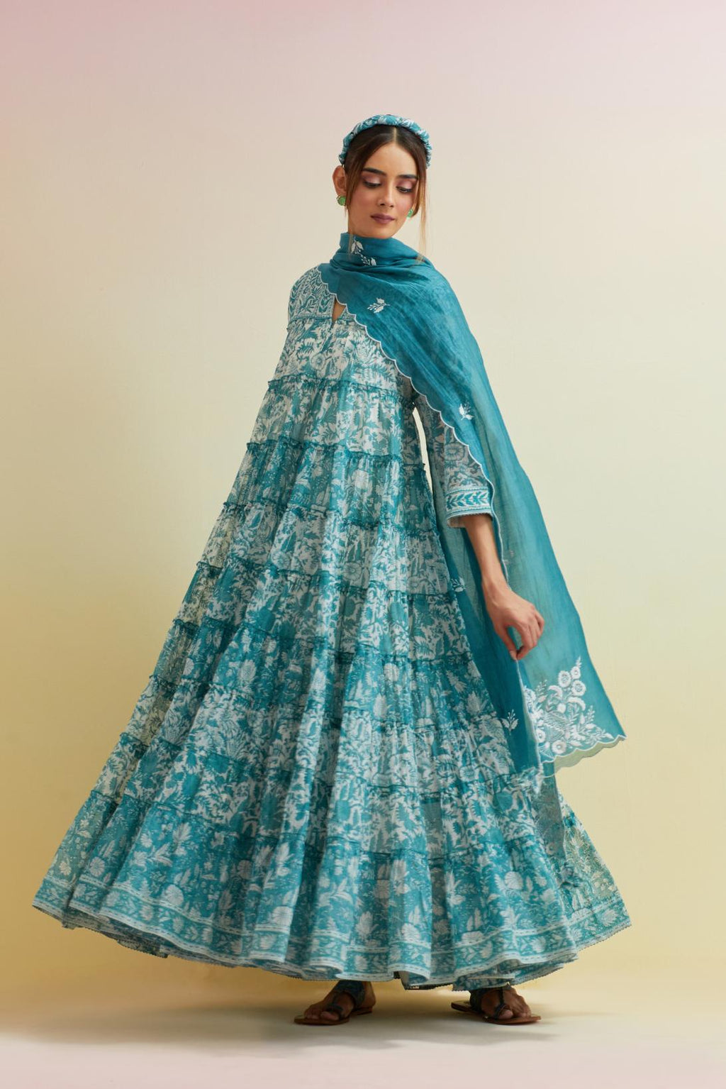 Tropical teal hand block printed multi-tiered kurta dress set with 3/4 sleeves, highlighted with thread embroidered yoke in front and back.