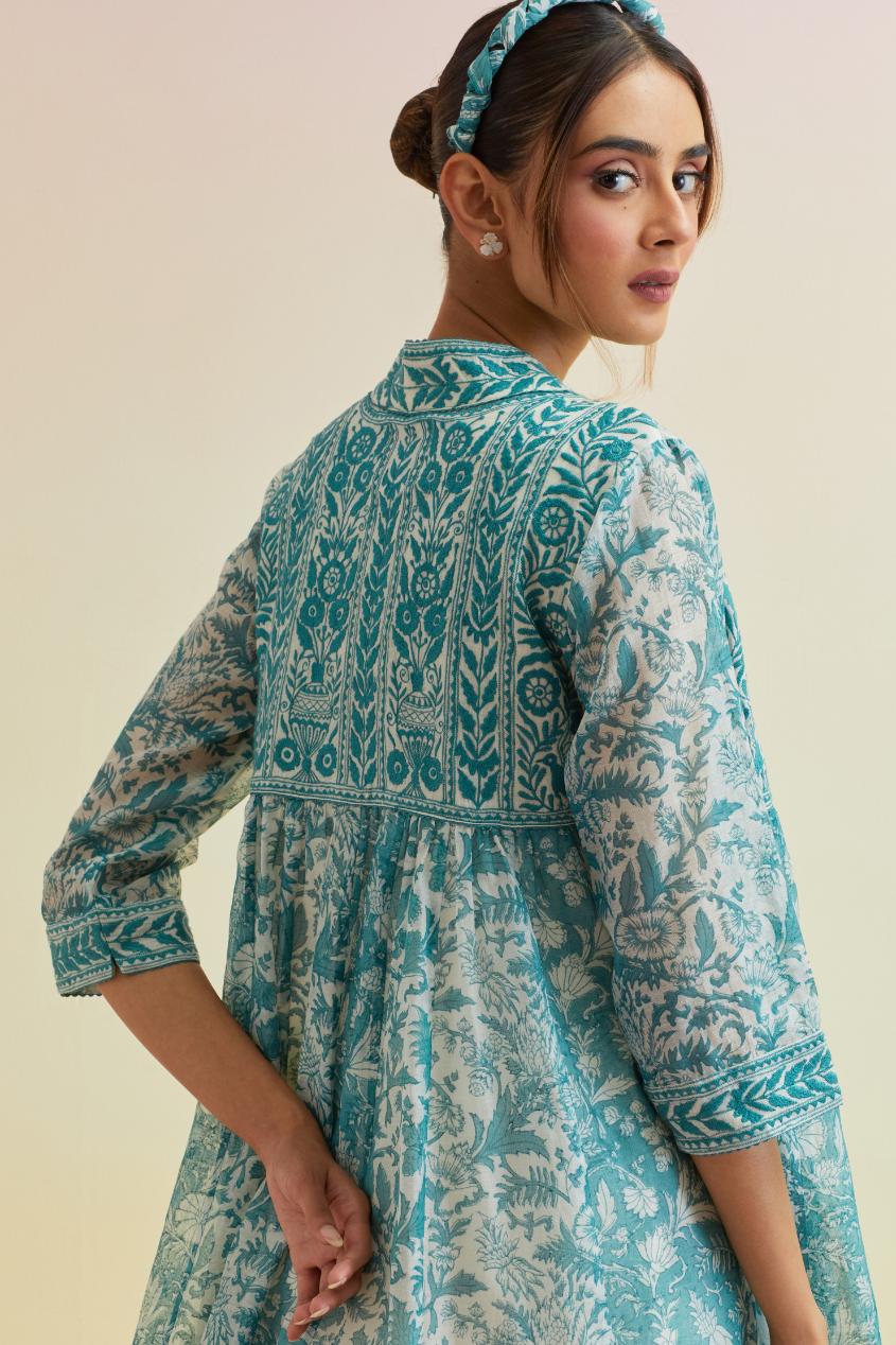 Tropical teal hand block printed short angrakha kurta with embroidered neckline, paired with off white cotton straight ankle length pants with embroidered boota at sides and all-over small floral booti.