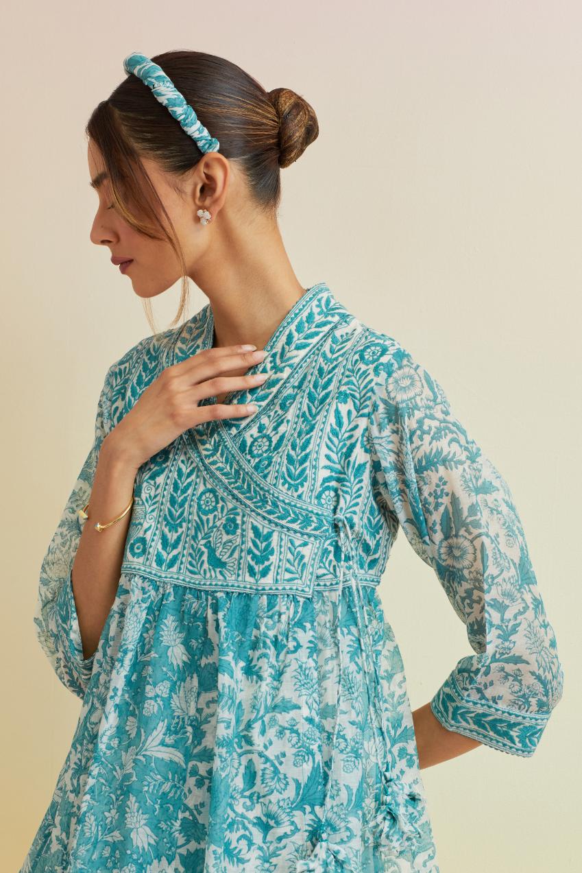 Tropical teal hand block printed short angrakha kurta with embroidered neckline, paired with off white cotton straight ankle length pants with embroidered boota at sides and all-over small floral booti.