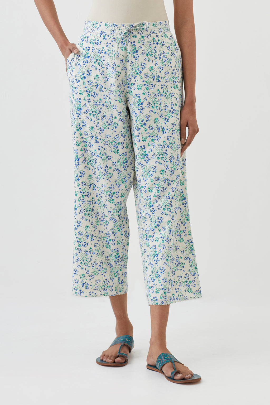 Off white cotton ankle length pants with all-over hand block print.