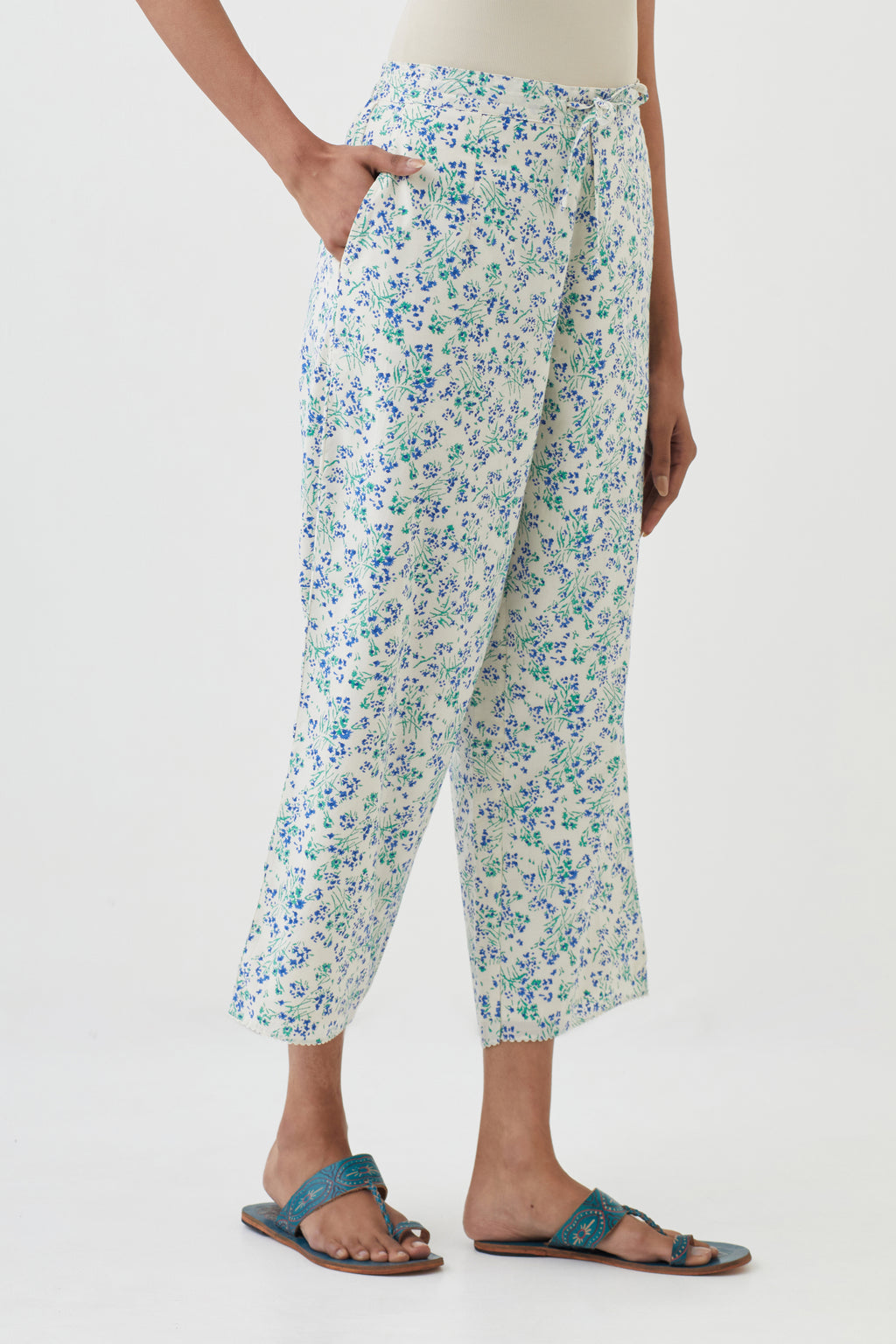 Off white cotton ankle length pants with all-over hand block print.