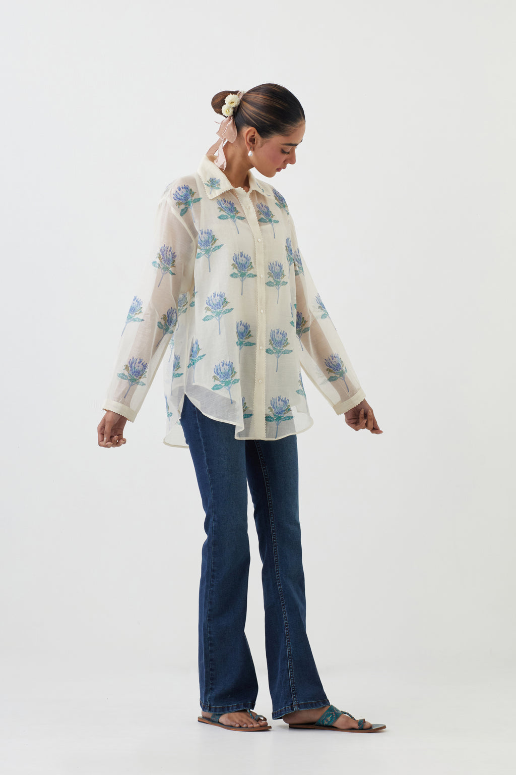 Off white cotton chanderi shirt with all-over blue floral hand block print and full sleeves.