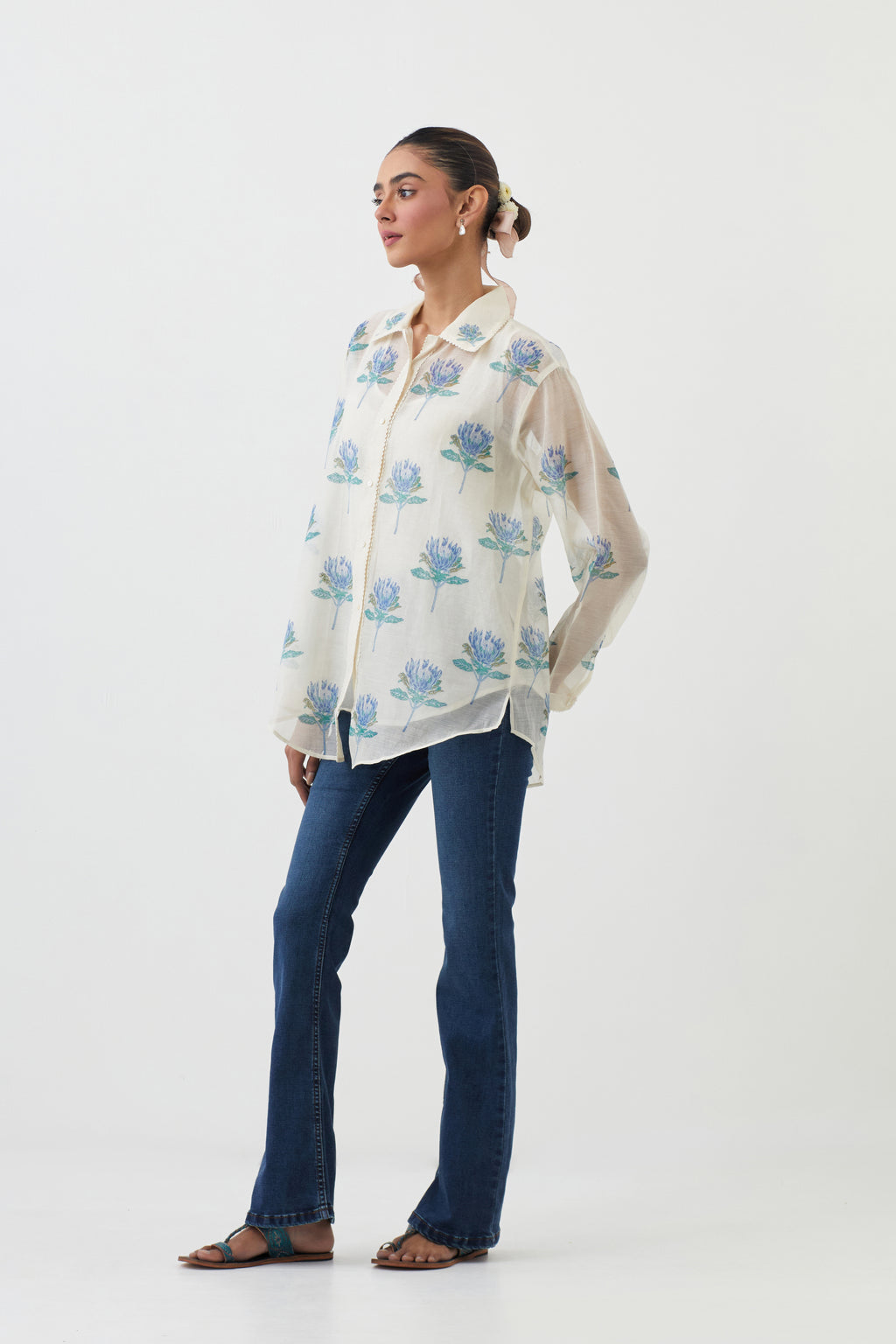 Off white cotton chanderi shirt with all-over blue floral hand block print and full sleeves.