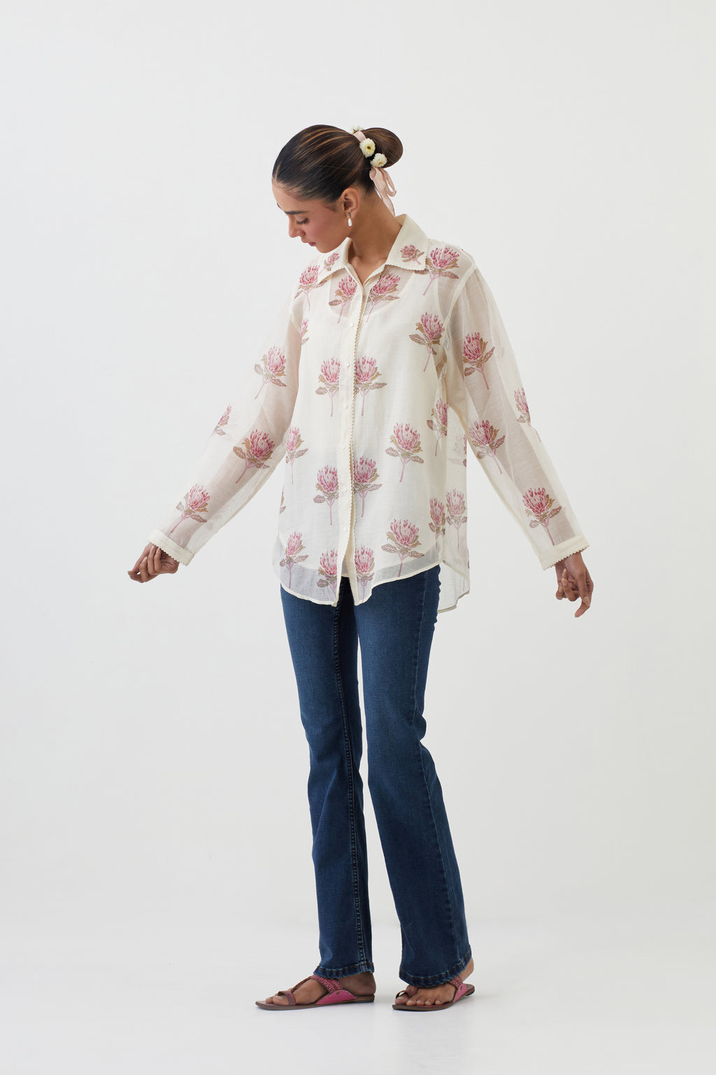Off white cotton chanderi shirt with all-over pink floral hand block print and full sleeves.