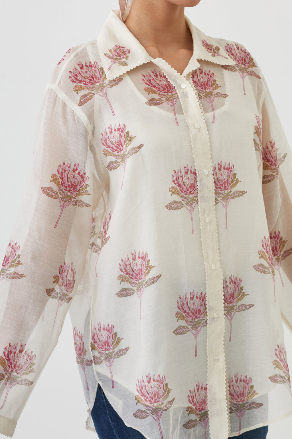 Off white cotton chanderi shirt with all-over pink floral hand block print and full sleeves.