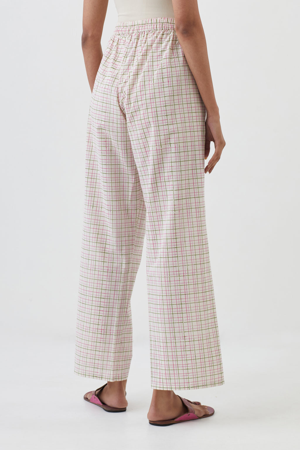 Off white cotton straight pants with all-over check hand block print.