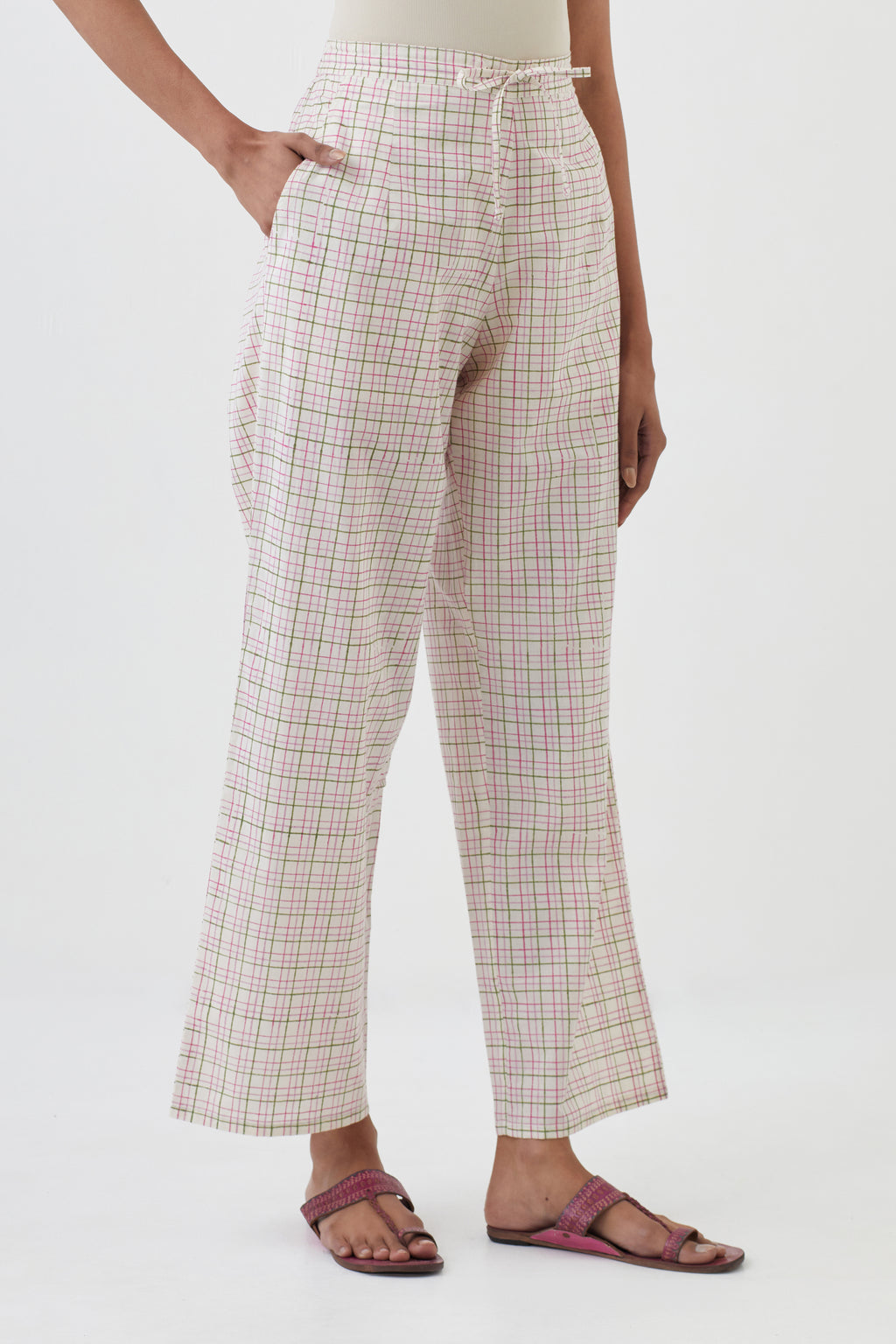 Off white cotton straight pants with all-over check hand block print.