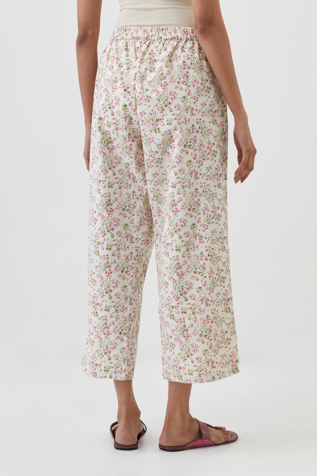 Off white cotton ankle length pants with all-over hand block print.