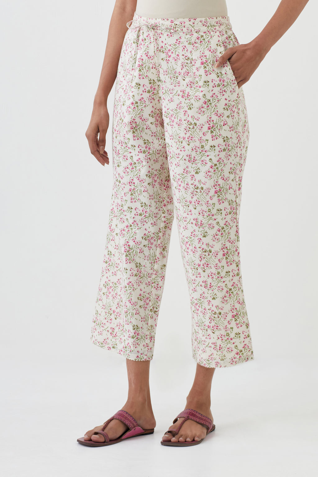 Off white cotton ankle length pants with all-over hand block print.