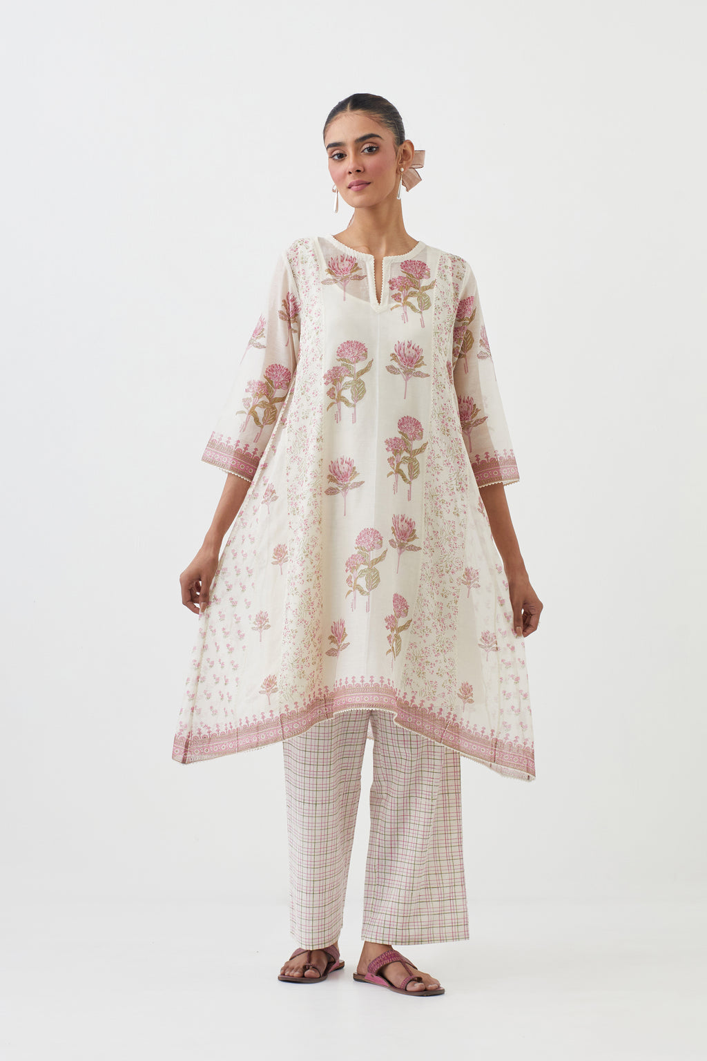 Off white hand block printed cotton chanderi short kalidar kurta set with all-over pink colored flower.